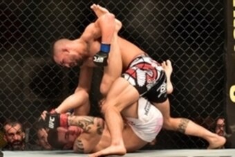May 30, 2015; Goiania, GO, Brazil; Lucas Martins (red gloves) fights Mirsad Bektic (blue gloves) during UFC Fight Night at Goiania Arena. Mandatory Credit: Jason Silva-USA TODAY Sports