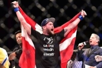 May 30, 2015; Goiania, GO, Brazil; Nicolas Dalby (blue gloves) reacts after defeating Elizeu Zaleski  during UFC Fight Night at Goiania Arena. Mandatory Credit: Jason Silva-USA TODAY Sports