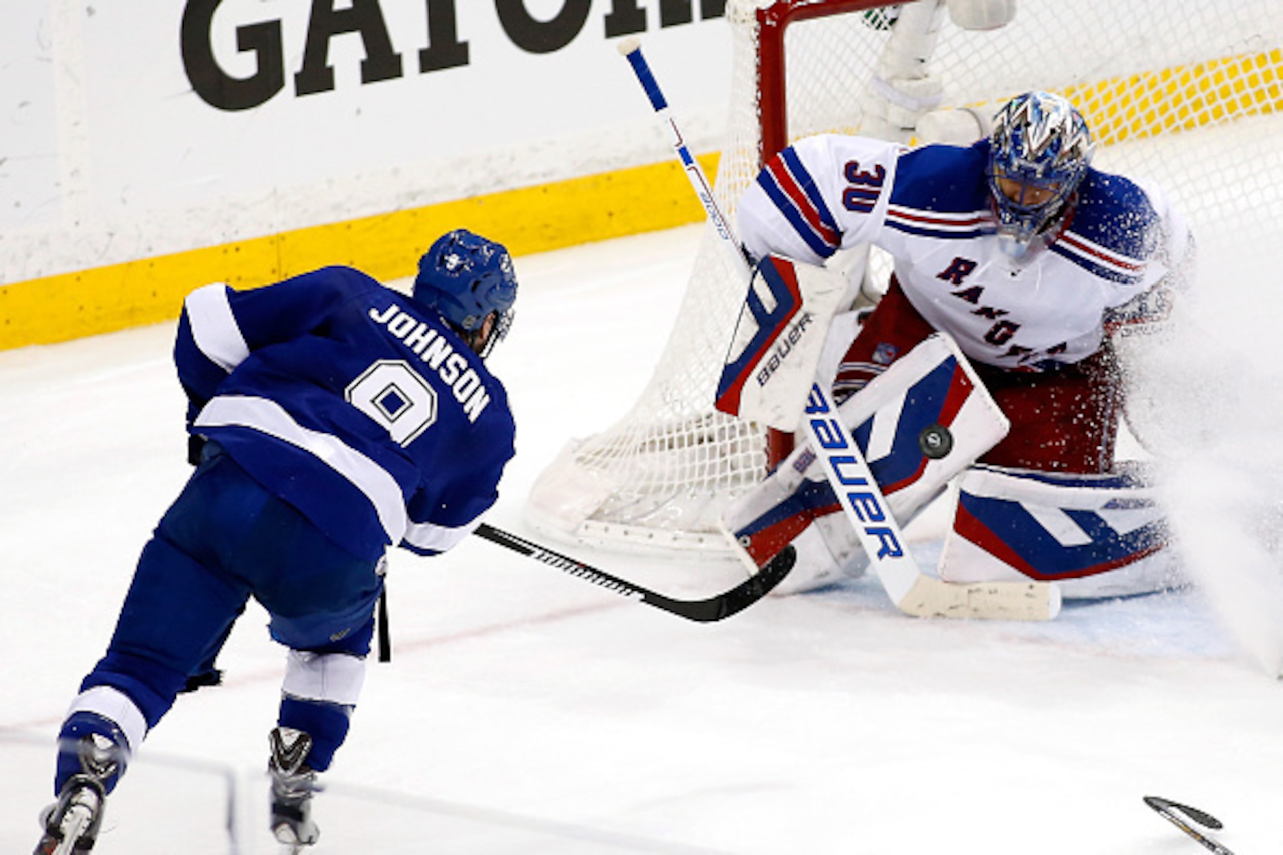 TAMPA, FL - MAY 26:  Tyler Johnson #9 of the Tampa Bay Lightning takes a shot on Henrik Lundqvist #30 of the New York Rangers in Game Six of the Eastern Conference Finals during the 2015 NHL Stanley Cup Playoffs at Amalie Arena on May 26, 2015 in Tampa, F