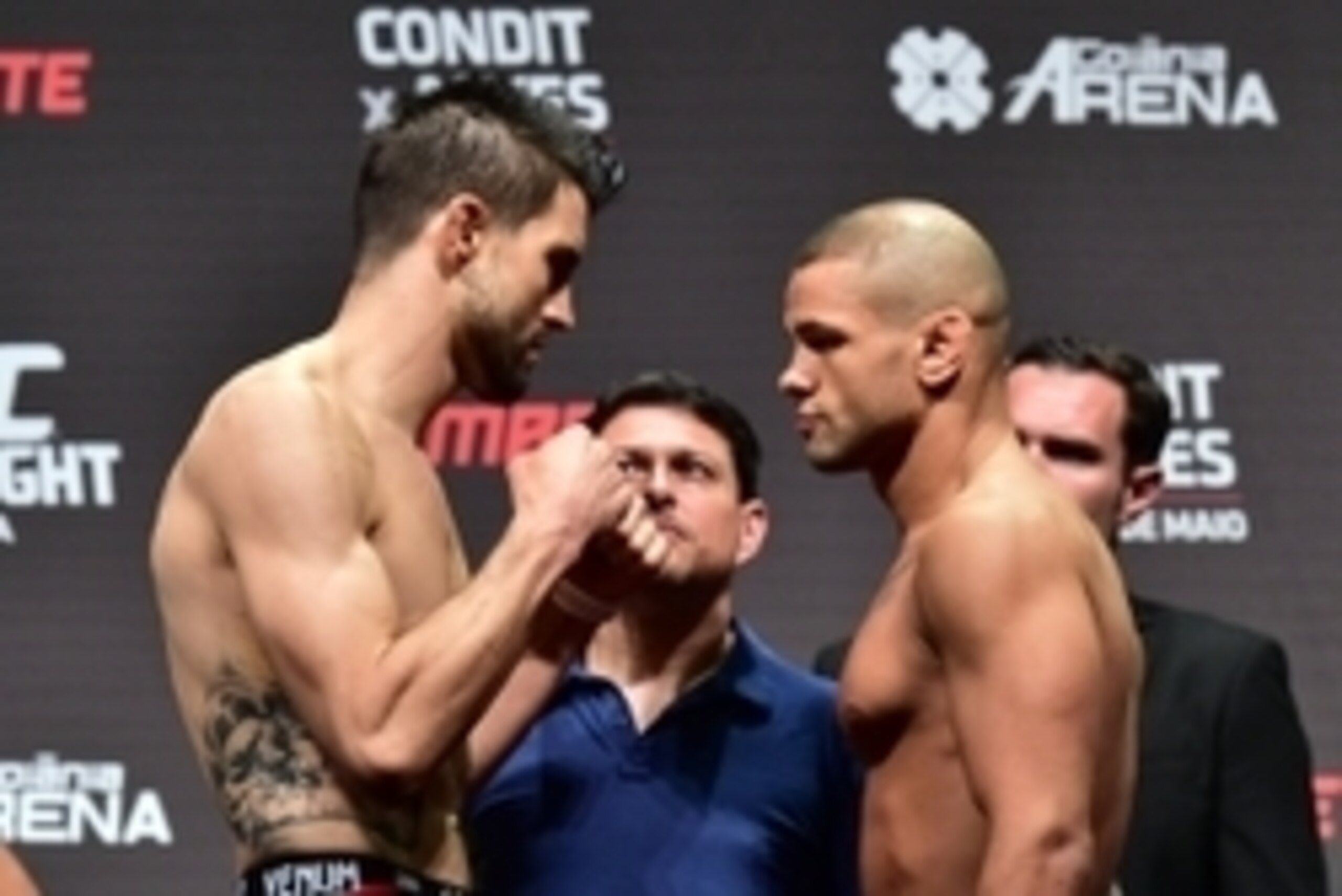 May 29, 2015; Goiania, GO, Brazil; Carlos Condit (left) and Thiago Alves  face off at the weigh-in for their fight at UFC Fight Night at Goiania Arena. Mandatory Credit: Jason Silva-USA TODAY Sports
