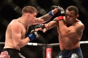 May 30, 2015; Goiania, GO, Brazil; Francisco Trinaldo (red gloves) fights Norman Parke (blue gloves) during UFC Fight Night at Goiania Arena. Mandatory Credit: Jason Silva-USA TODAY Sports