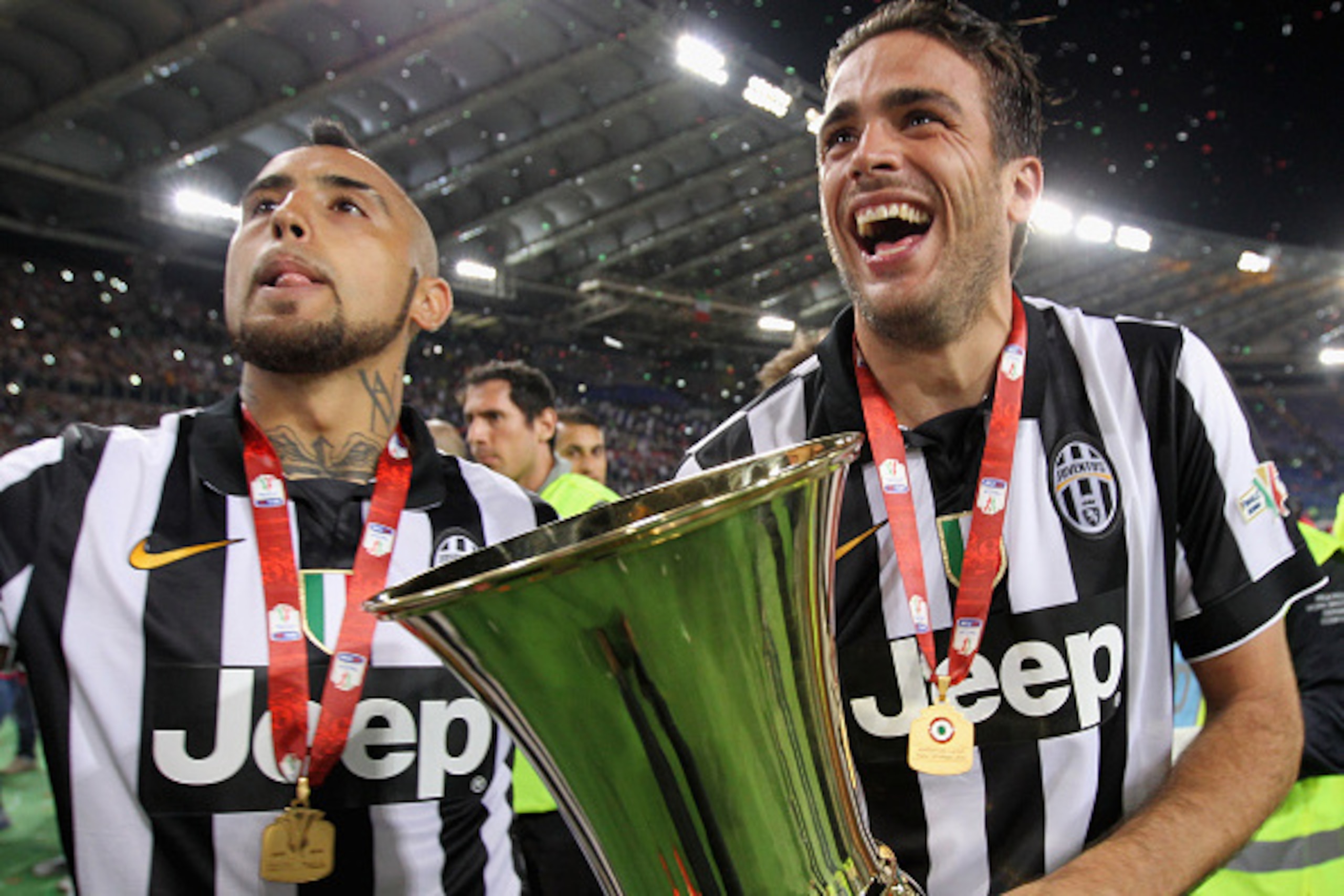 ROME, ITALY - MAY 20: (L-R) Arturo Vidal and Alessandro Matri of Juventus FC celebrate with the trophy after winning the TIM Cup final match against SS Lazio at Olimpico Stadium on May 20, 2015 in Rome, Italy.  (Photo by Paolo Bruno/Getty Images)
