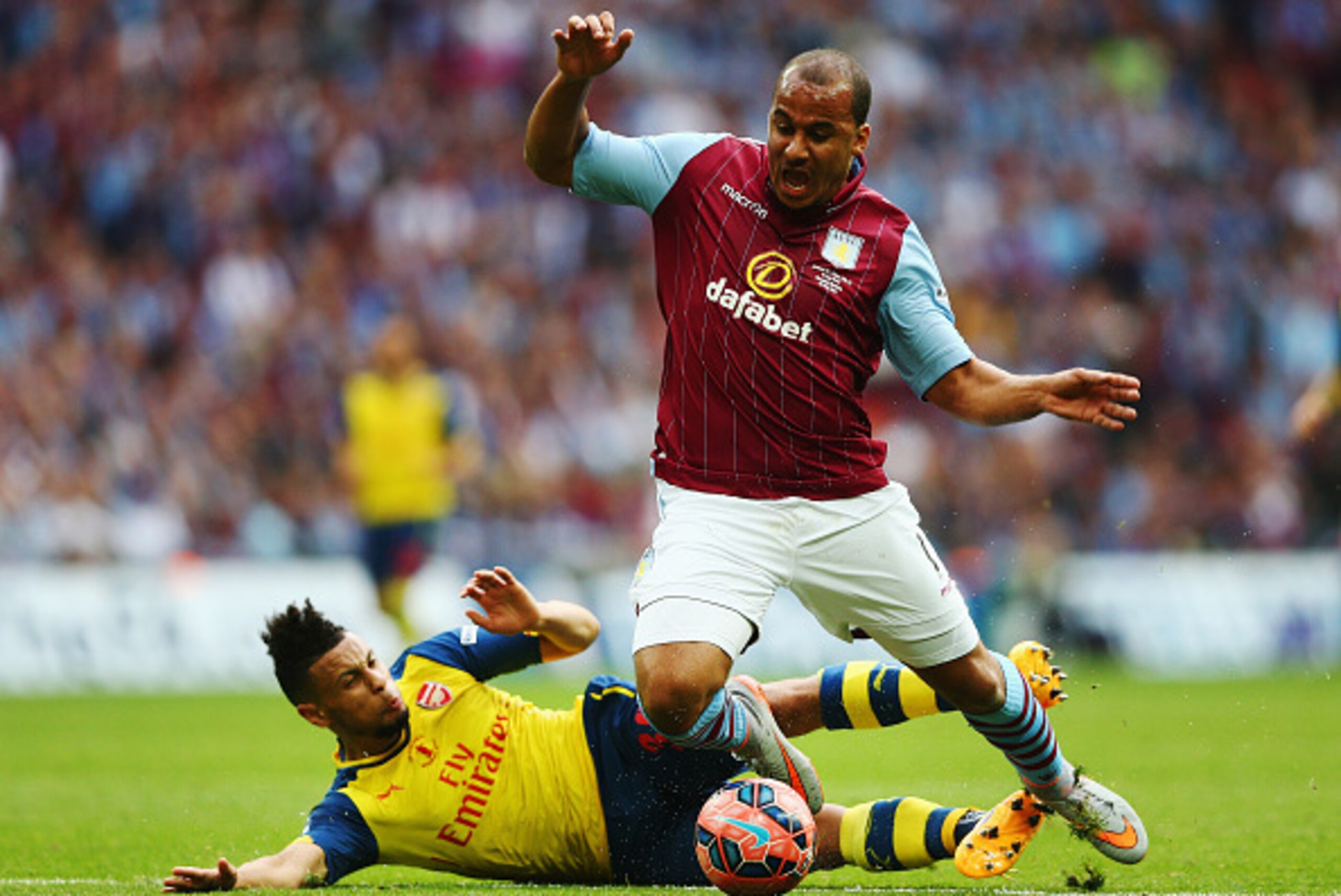 LONDON, ENGLAND - MAY 30:  Gabriel Agbonlahor of Aston Villa is challenged by Francis Coquelin of Arsenal during the FA Cup Final between Aston Villa and Arsenal at Wembley Stadium on May 30, 2015 in London, England.  (Photo by Paul Gilham/Getty Images)