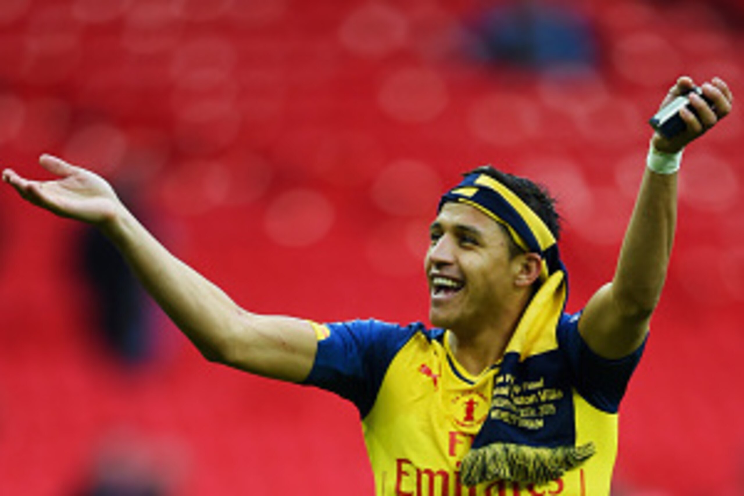 LONDON, ENGLAND - MAY 30:  Alexis Sanchez of Arsenal celebrates victory after the FA Cup Final between Aston Villa and Arsenal at Wembley Stadium on May 30, 2015 in London, England. Arsenal beat Aston Villa 4-0.  (Photo by Shaun Botterill/Getty Images)