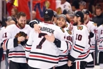 May 30, 2015; Anaheim, CA, USA; Chicago Blackhawks right wing Patrick Kane (88) hugs defenseman Brent Seabrook (7) after game seven of the Western Conference Final of the 2015 Stanley Cup Playoffs against the Anaheim Ducks at Honda Center. Mandatory Credi