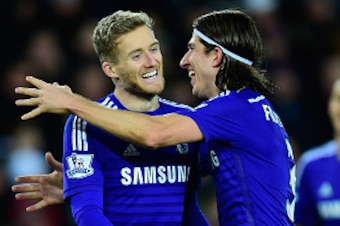 SWANSEA, WALES - JANUARY 17:  Chelsea player Andre Schurrle celebrates after scoring the fifth goal with Filiipe Luis (r) during the Barclays Premier League match between Swansea City and Chelsea at Liberty Stadium on January 17, 2015 in Swansea, Wales.  