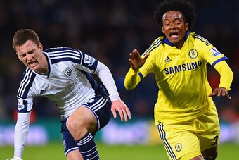 WEST BROMWICH, ENGLAND - MAY 18:  Craig Gardner of West Bromwich Albion and Juan Cuadrado of Chelsea stumble as they battle for the ball during the Barclays Premier League match between West Bromwich Albion and Chelsea at The Hawthorns on May 18, 2015 in 