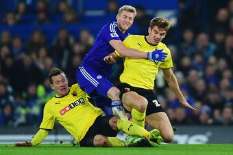 LONDON, ENGLAND - JANUARY 04:  Andre Schuerrle of Chelsea (C) is challenged by Daniel Tozser (L) and Tommie Hoban of Watford during the FA Cup Third Round match between Chelsea and Watford at Stamford Bridge on January 4, 2015 in London, England.  (Photo 