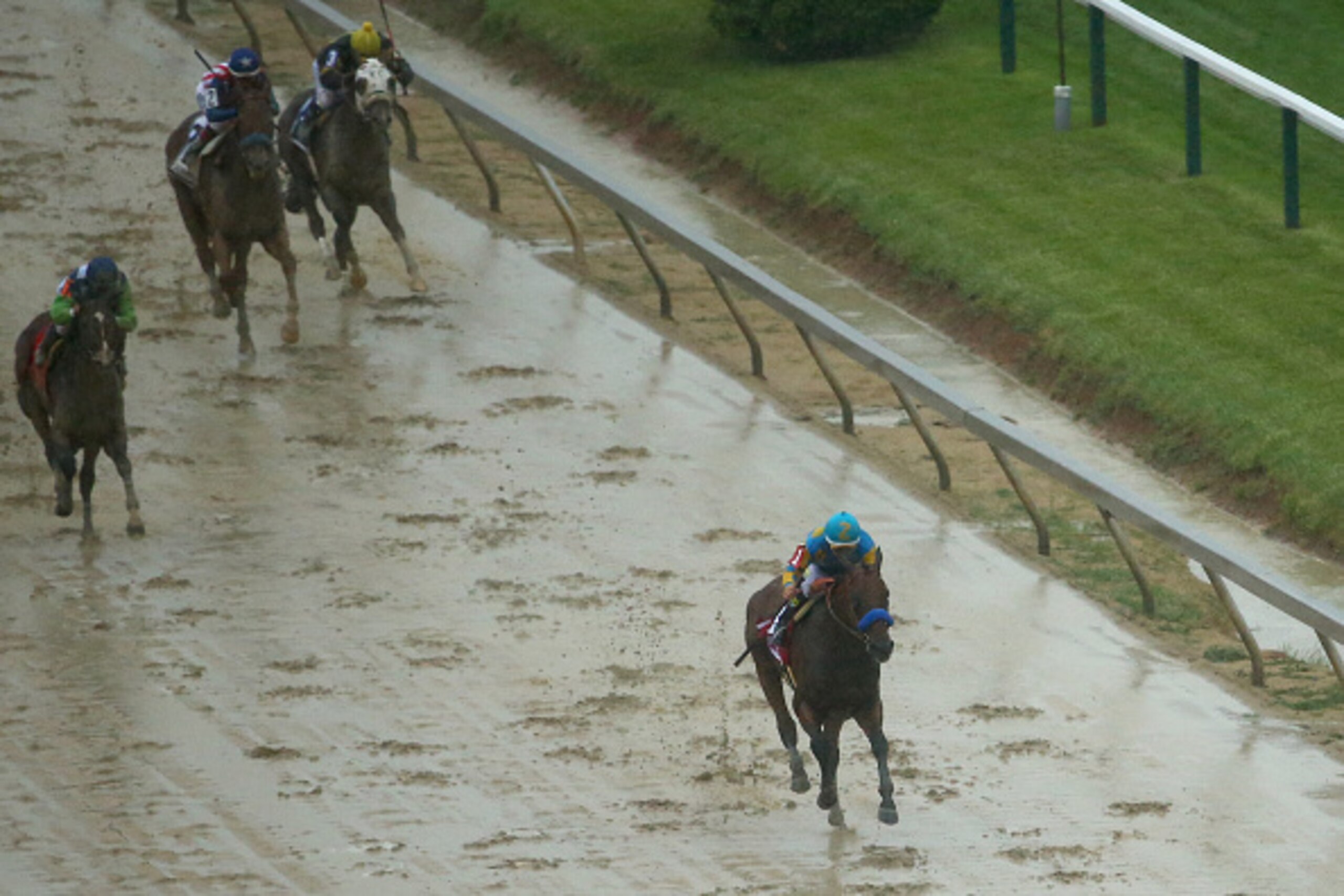BALTIMORE, MD - MAY 16:  American Pharoah ridden by Victor Espinoza approaches the finish line to win the 140th running of the Preakness Stakes at Pimlico Race Course on May 16, 2015 in Baltimore, Maryland.  (Photo by Maddie Meyer/Getty Images)