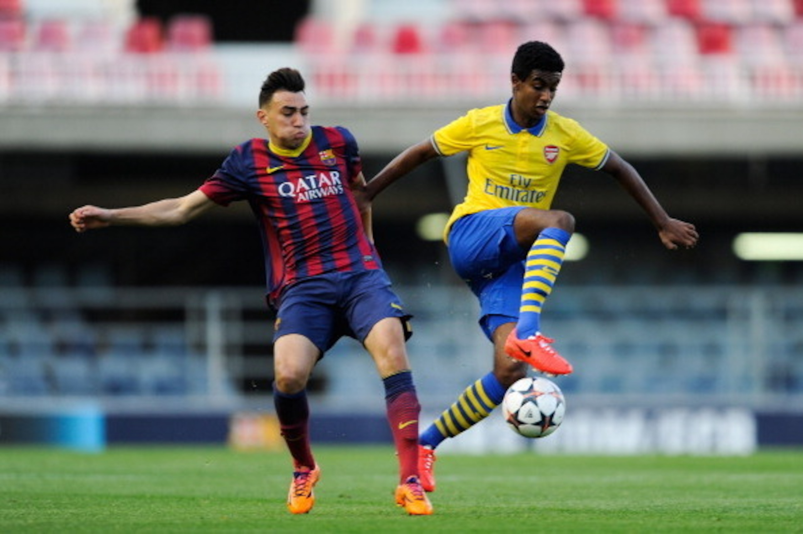 BARCELONA, SPAIN - MARCH 18:  Gedion Zelalem of Arsenal duels for the ball with Munir El Haddadi of FC Barcelona during the UEFA Youth League Quarter FInal match between FC Barcelona U19 and Arsenal U19 at Mini Estadi on March 18, 2014 in Barcelona, Spain