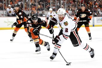 ANAHEIM, CA - MAY 30:  Duncan Keith #2 of the Chicago Blackhawks shoots the puck ahead of Simon Despres #24 of the Anaheim Ducks in the second period in Game Seven of the Western Conference Finals during the 2015 NHL Stanley Cup Playoffs  at the Honda Cen