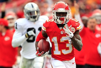 KANSAS CITY, MO - DECEMBER 14:  De'Anthony Thomas #13 of the Kansas City Chiefs returns a punt for a touchdown against the Oakland Raiders during the first quarter at Arrowhead Stadium on December 14, 2014 in Kansas City, Missouri.  (Photo by Jamie Squire