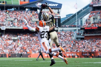 CLEVELAND, OH - SEPTEMBER 14: Cornerback Joe Haden #23 of the Cleveland Browns puts pressure on tight end Jimmy Graham #80 of the New Orleans Saints as Graham catches a touchdown pass during the first half at FirstEnergy Stadium on September 14, 2014 in C