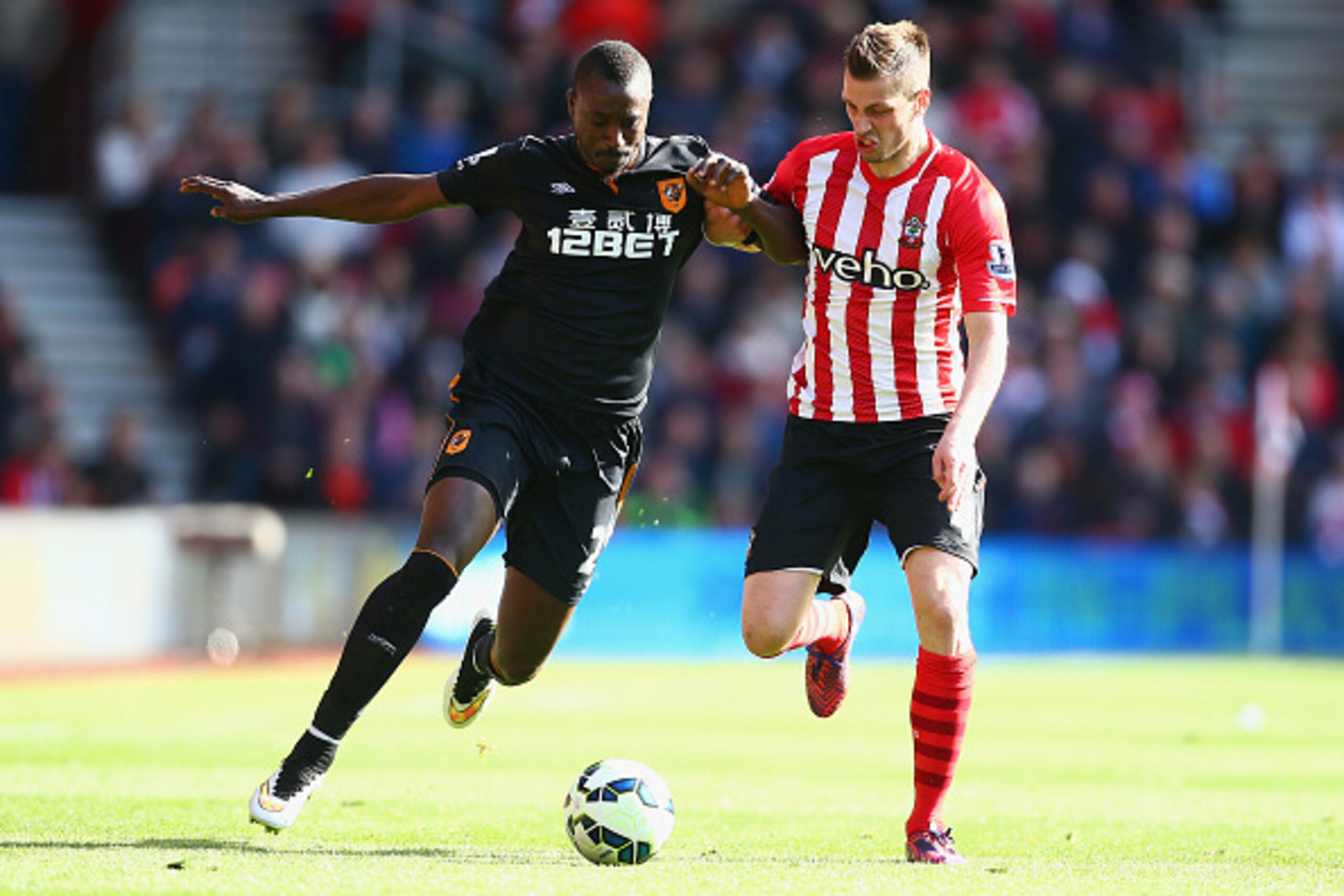 SOUTHAMPTON, ENGLAND - APRIL 11:  Liam Rosenior of Hull City holds off Morgan Schneiderlin of Southampton  during the Barclays Premier League match between Southampton and Hull City at St Mary's Stadium on April 11, 2015 in Southampton, England.  (Photo b