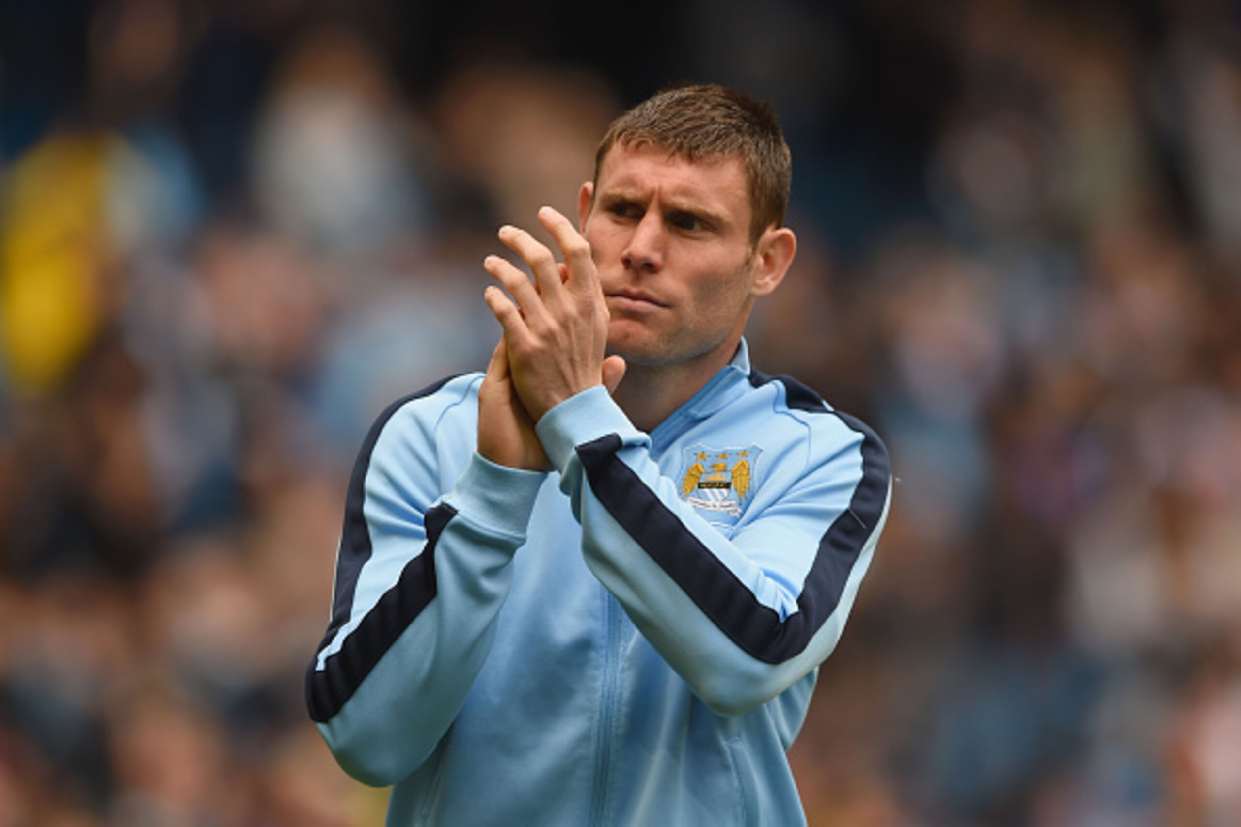 MANCHESTER, ENGLAND - MAY 24:  James Milner of Manchester City applauds supporters after the Barclays Premier League match between Manchester City and Southampton at Etihad Stadium on May 24, 2015 in Manchester, England.  (Photo by Shaun Botterill/Getty I