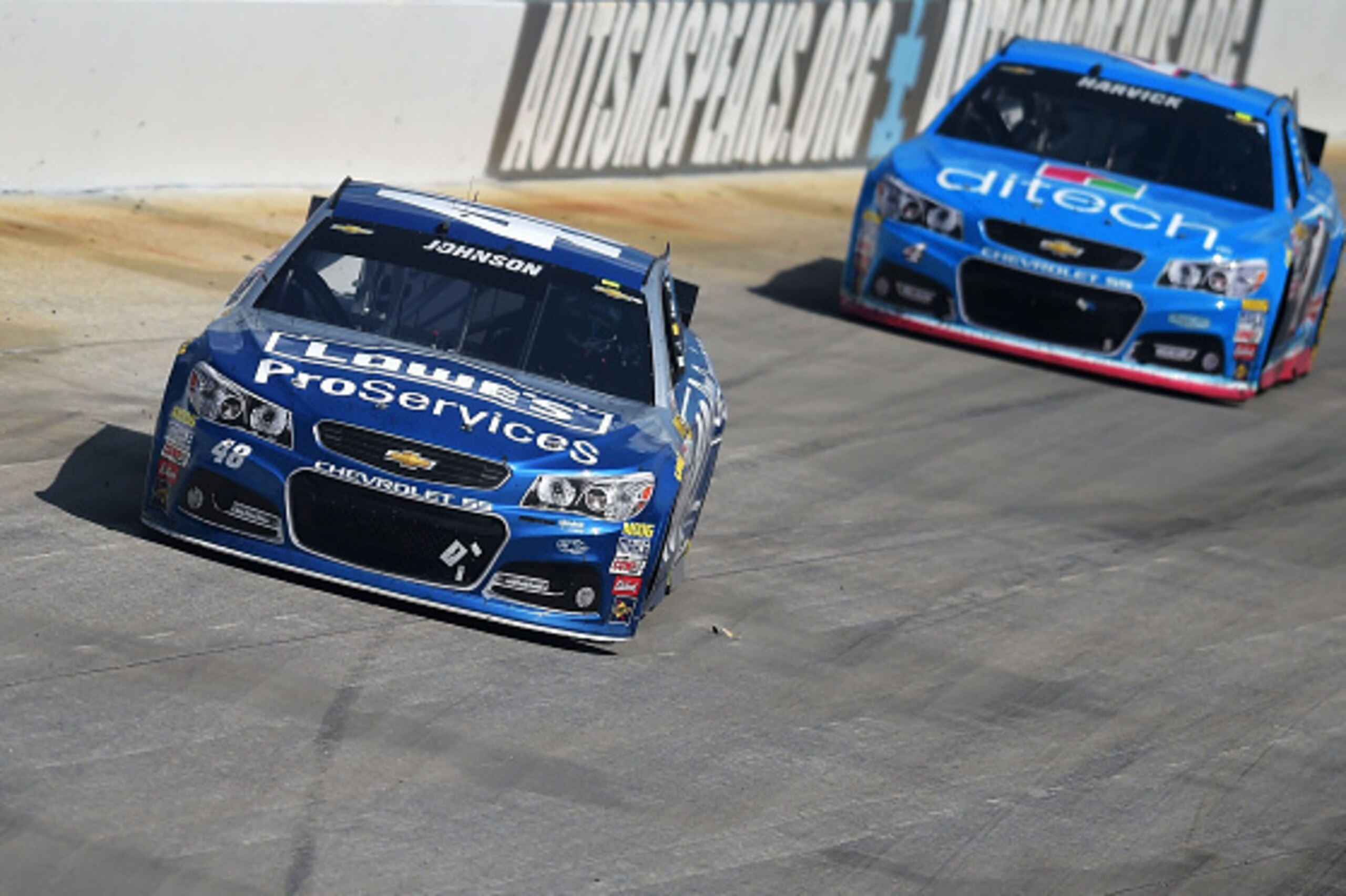DOVER, DE - MAY 31: Jimmie Johnson, driver of the #48 Lowe's Pro Services Chevrolet, leads Kevin Harvick, driver of the #4 ditech Chevrolet, during the NASCAR Sprint Cup Series FedEx 400 Benefiting Autism Speaks at Dover International Speedway on May 31, DOVER, DE - MAY 31: Jimmie Johnson, driver of the #48 Lowe's Pro Services Chevrolet, leads Kevin Harvick, driver of the #4 ditech Chevrolet, during the NASCAR Sprint Cup Series FedEx 400 Benefiting Autism Speaks at Dover International Speedway on May 31,