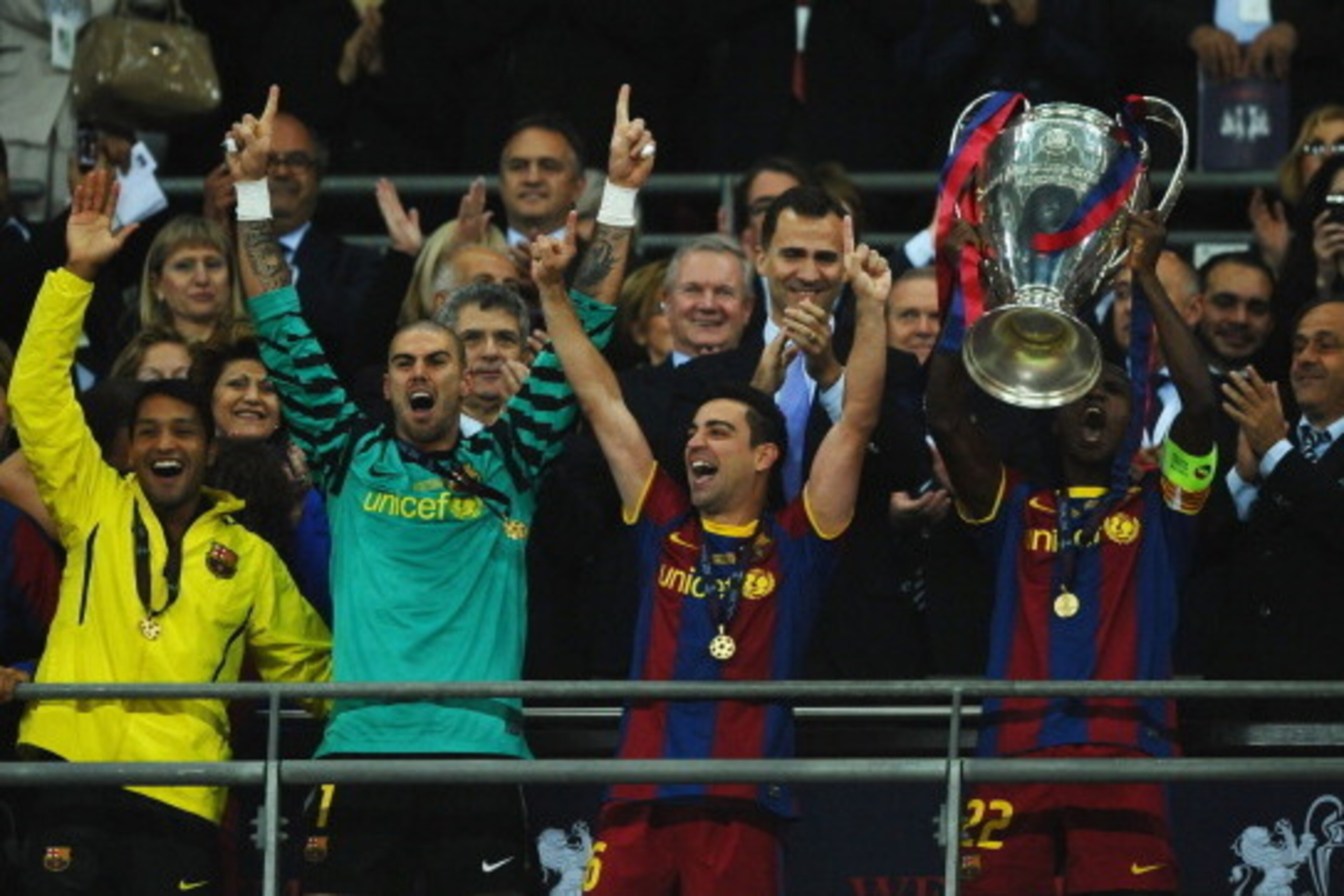 LONDON, ENGLAND - MAY 28:  Prince Filipe of Spain applauds as Eric Abidal (R) of FC Barcelona lifts the trophy and celebrates with teammates Victor Valdes (2L) and Xavi (2R) after victory in the UEFA Champions League final between FC Barcelona and Manches