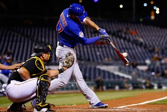 PITTSBURGH, PA - APRIL 20: Kris Bryant #17 of the Chicago Cubs hits an RBI single in the fifth inning against the Pittsburgh Pirates during the game at PNC Park on April 20, 2015 in Pittsburgh, Pennsylvania.  (Photo by Jared Wickerham/Getty Images)
