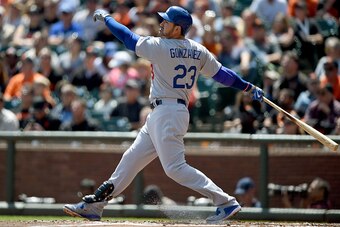 SAN FRANCISCO, CA - APRIL 23:  Adrian Gonzalez #23 of the Los Angeles Dodgers swings and watches the flight of his ball as he hits a solo home run in the top of the third inning at AT&T Park on April 23, 2015 in San Francisco, California.  (Photo by Thear