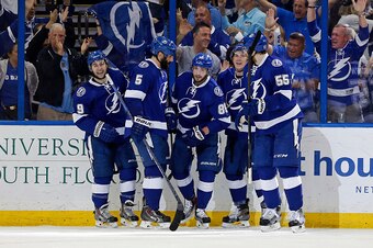 TAMPA, FL - MAY 12: Nikita Kucherov #86 of the Tampa Bay Lightning (C) celebrates his goal against the Montreal Canadiens with teammates Tyler Johnson #9, Jason Garrison #5, Ondrej Palat #18, and Braydon Coburn #55 in Game Six of the Eastern Conference Se