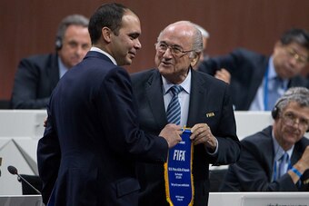 ZURICH, SWITZERLAND - MAY 29: Jordanian Prince Ali bin al Hussein, FIFA vice president and Challenger to Joseph S. Blatter for the FIFA presidency (L) receives a pennant from FIFA President Joseph S. Blatter during the 65th FIFA Congress at Hallenstadion 