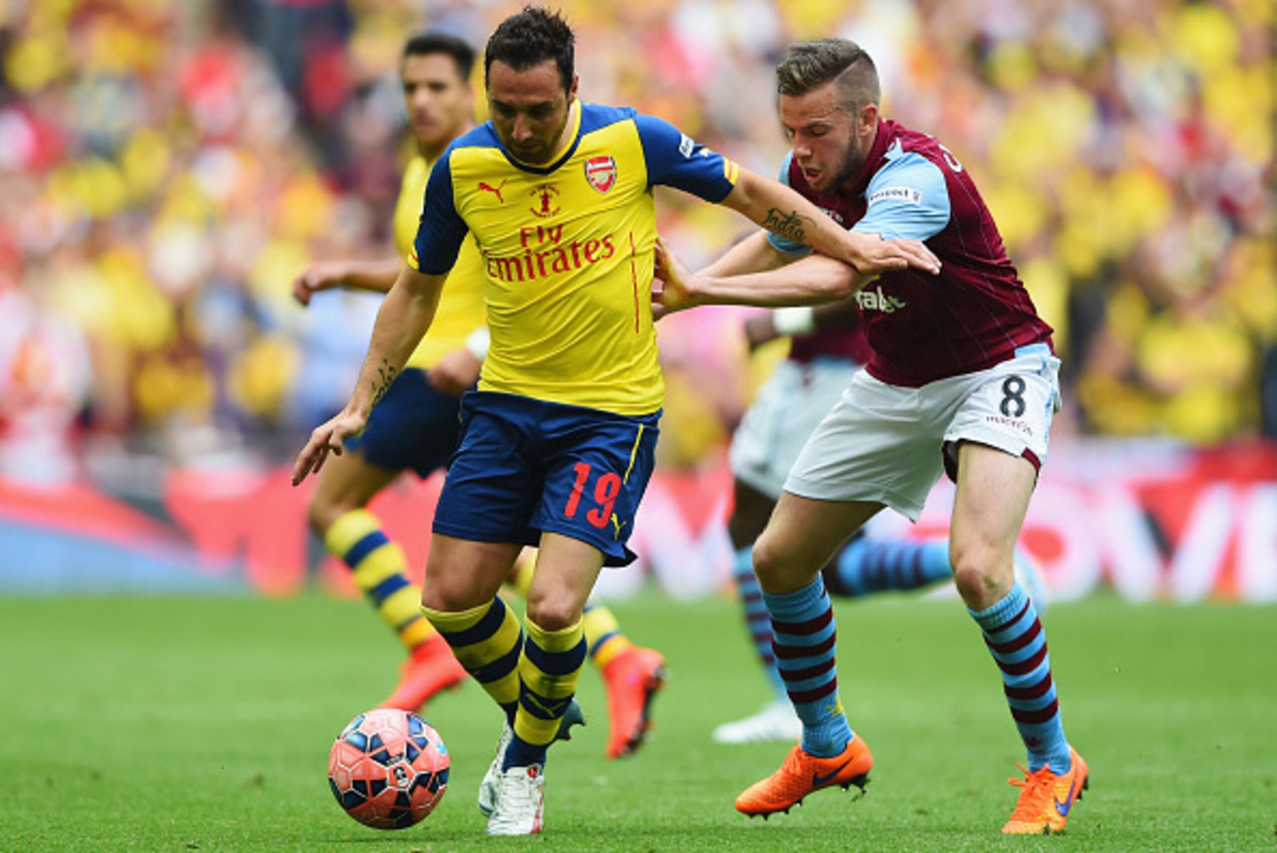 LONDON, ENGLAND - MAY 30: Santi Cazorla of Arsenal holds off Tom Cleverley of Aston Villa during the FA Cup Final between Aston Villa and Arsenal at Wembley Stadium on May 30, 2015 in London, England. (Photo by Shaun Botterill/Getty Images) LONDON, ENGLAND - MAY 30: Santi Cazorla of Arsenal holds off Tom Cleverley of Aston Villa during the FA Cup Final between Aston Villa and Arsenal at Wembley Stadium on May 30, 2015 in London, England. (Photo by Shaun Botterill/Getty Images)