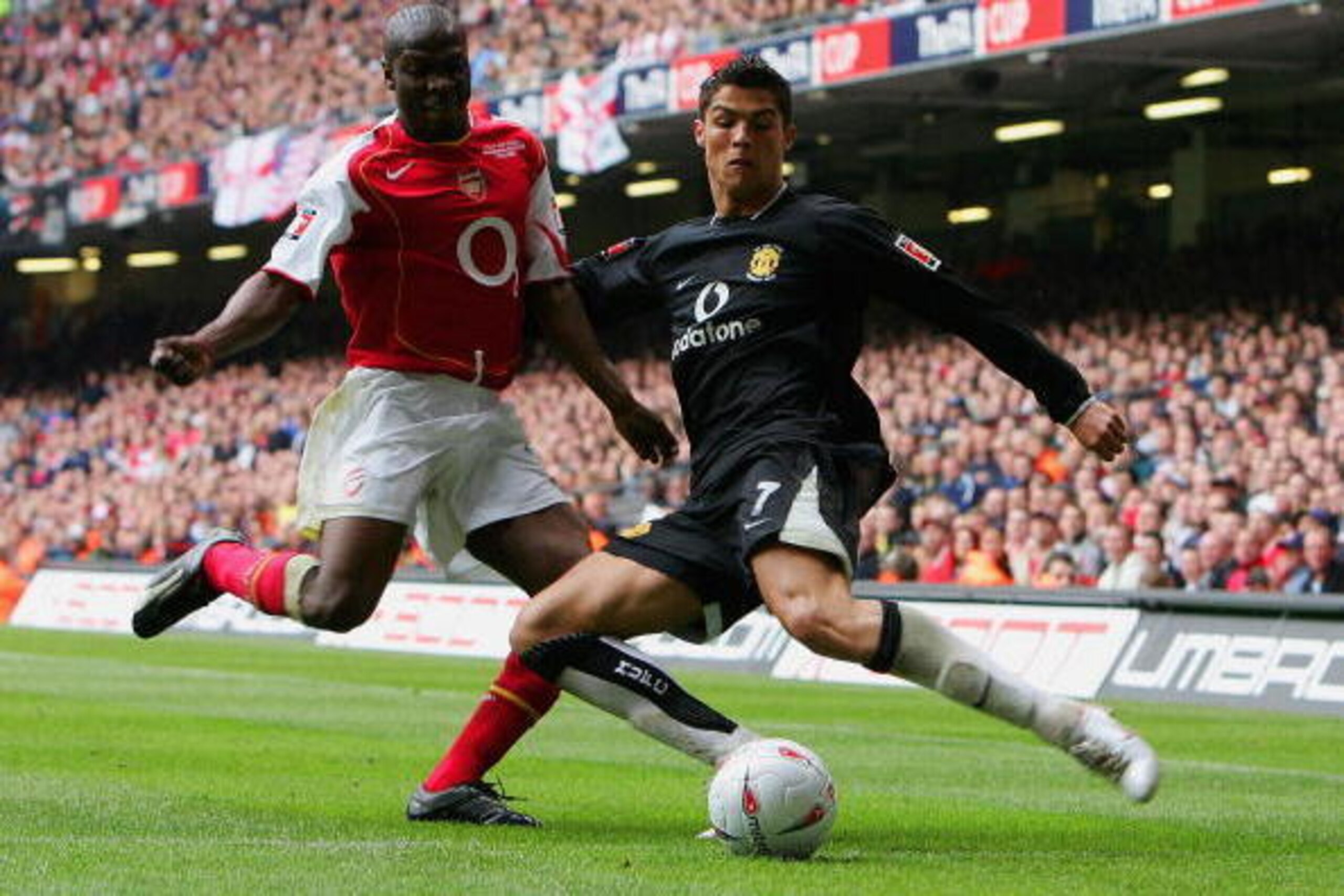 CARDIFF, UNITED KINGDOM - MAY 21: Lauren of Arsenal tries to stop Ronaldo of Manchester United crossing the ball during the FA Cup Final between Arsenal and Manchester United at The Millennium Stadium on May 21, 2005 in Cardiff, Wales. (Photo by Phil Co CARDIFF, UNITED KINGDOM - MAY 21: Lauren of Arsenal tries to stop Ronaldo of Manchester United crossing the ball during the FA Cup Final between Arsenal and Manchester United at The Millennium Stadium on May 21, 2005 in Cardiff, Wales. (Photo by Phil Co