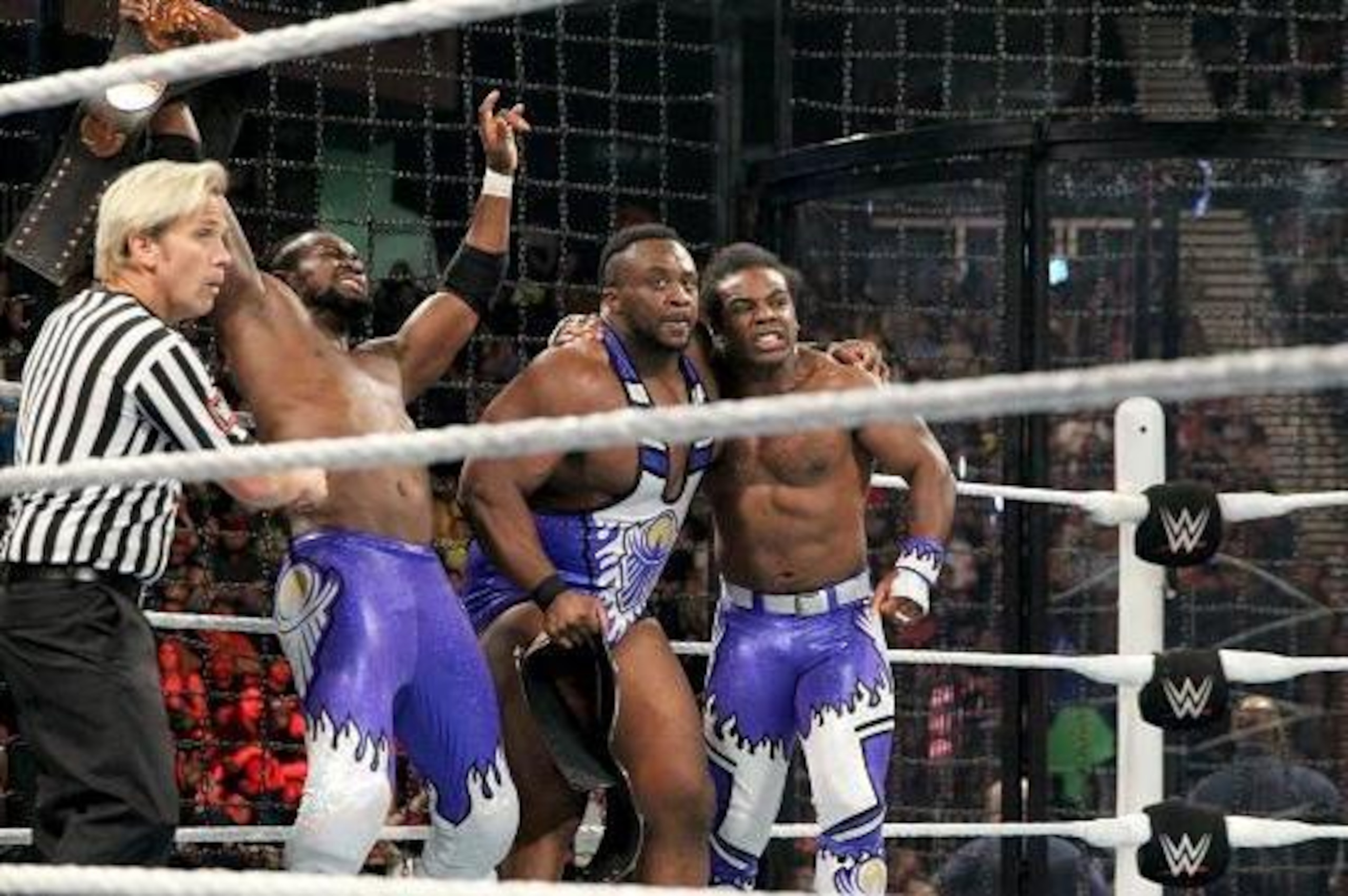 Kofi Kingston, Big E and Xavier Woods of The New Day celebrate retaining their titles.