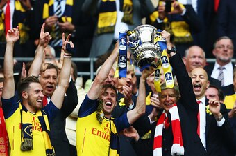 LONDON, ENGLAND - MAY 30:  Nacho Monreal of Arsenal and Arsene Wenger manager of Arsenal
lift the winners trophy following the FA Cup Final between Aston Villa and Arsenal at Wembley Stadium on May 30, 2015 in London, England.  (Photo by Paul Gilham/Getty