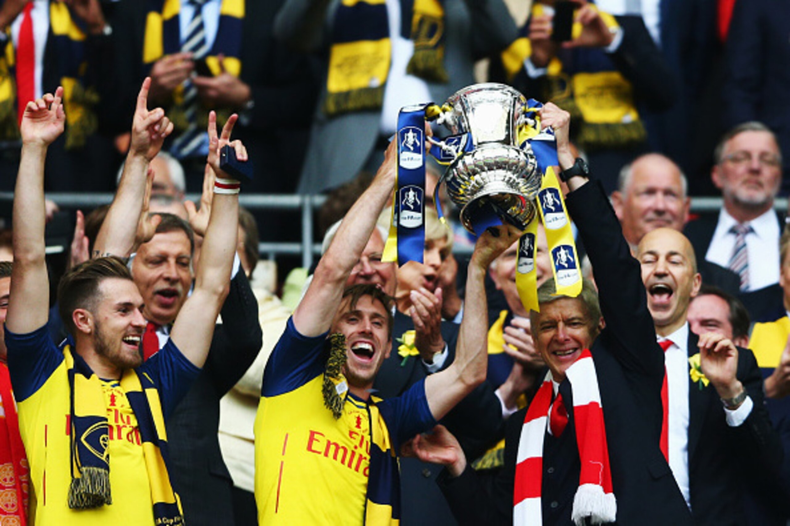 LONDON, ENGLAND - MAY 30: Nacho Monreal of Arsenal and Arsene Wenger manager of Arsenal
lift the winners trophy following the FA Cup Final between Aston Villa and Arsenal at Wembley Stadium on May 30, 2015 in London, England. (Photo by Paul Gilham/Getty LONDON, ENGLAND - MAY 30: Nacho Monreal of Arsenal and Arsene Wenger manager of Arsenal
lift the winners trophy following the FA Cup Final between Aston Villa and Arsenal at Wembley Stadium on May 30, 2015 in London, England. (Photo by Paul Gilham/Getty