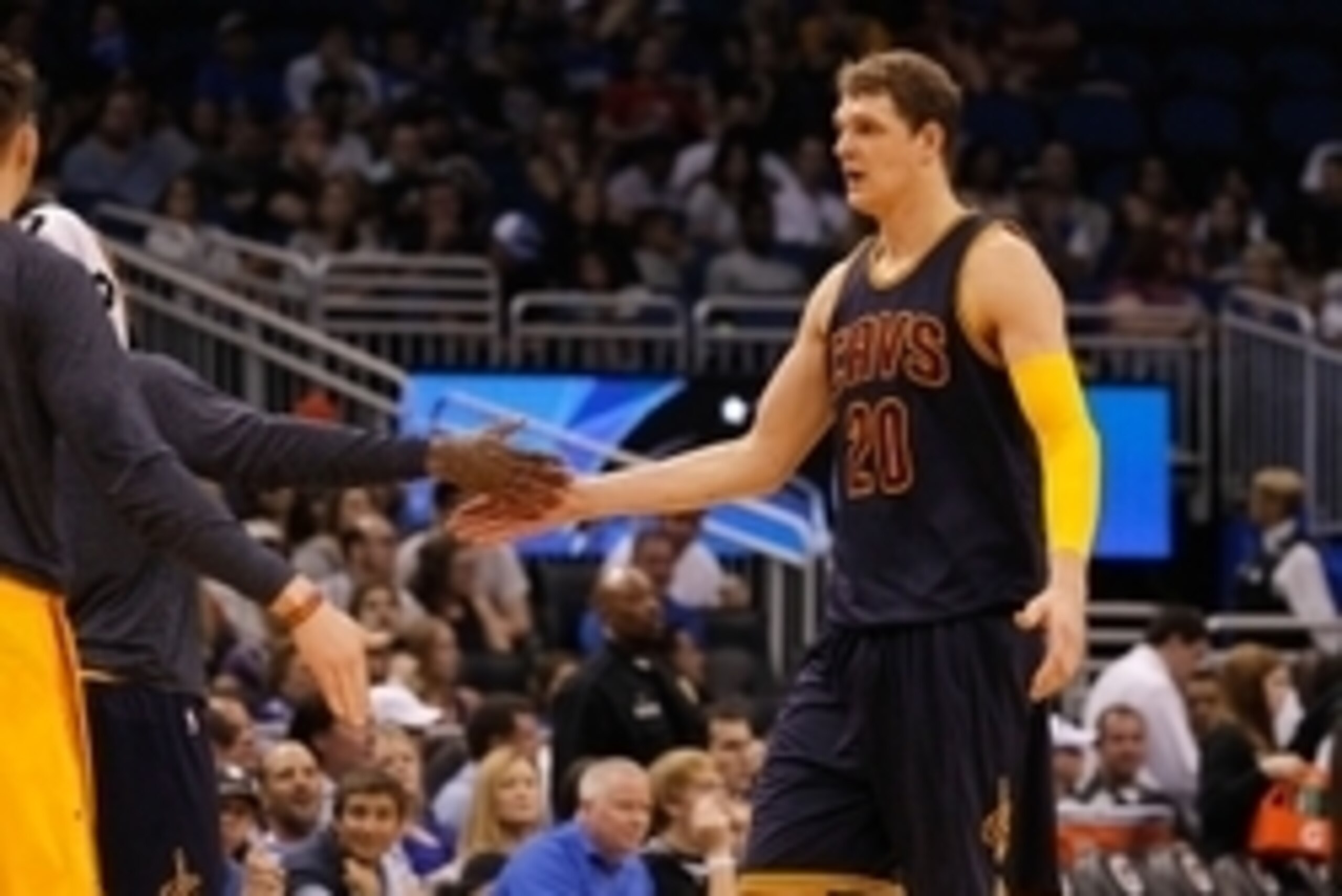 Mar 15, 2015; Orlando, FL, USA;Cleveland Cavaliers center Timofey Mozgov (20) high fives teammates against the Orlando Magic  during the second quarter at Amway Center. Mandatory Credit: Kim Klement-USA TODAY Sports