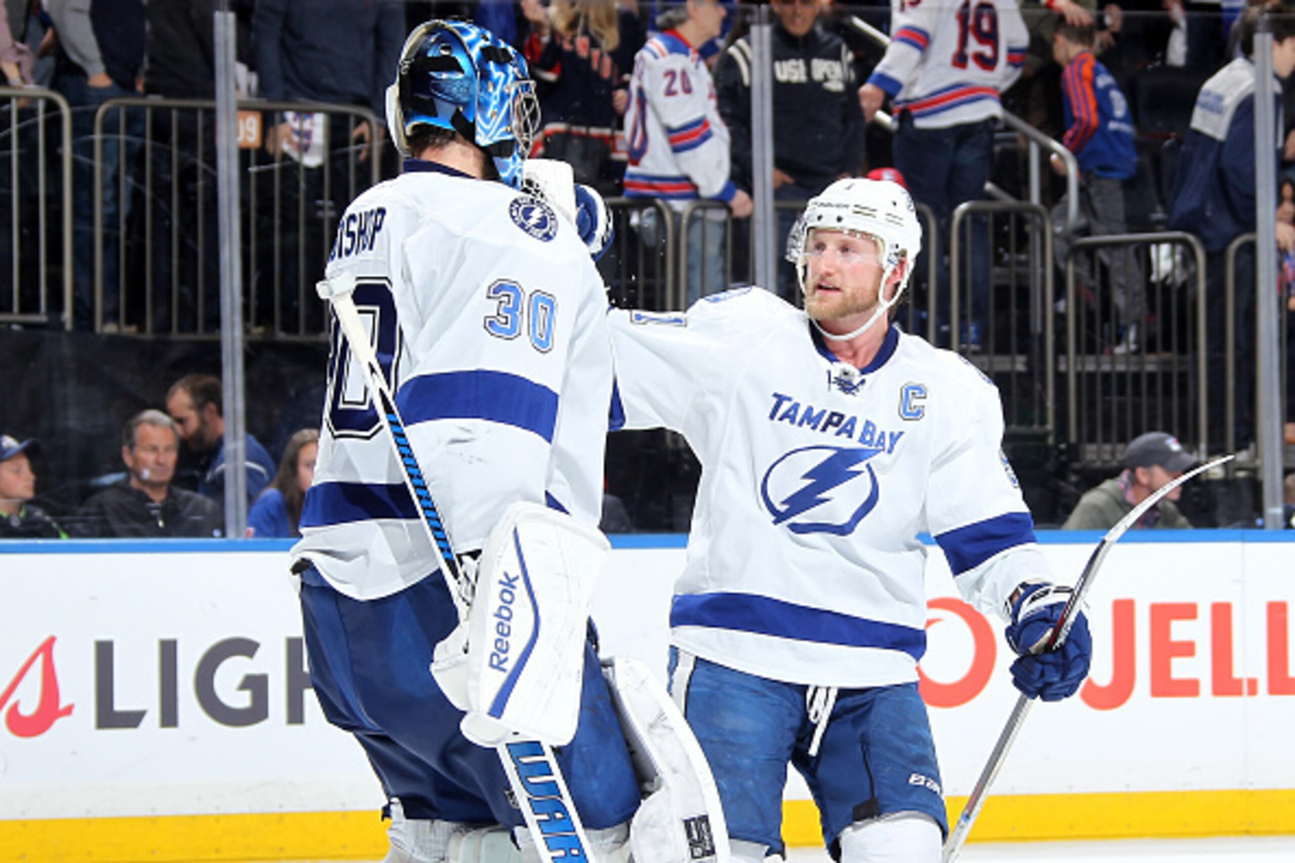 NEW YORK, NY - MAY 24:  Steven Stamkos #91 of the Tampa Bay Lightning celebrates with Ben Bishop #30 after defeating the New York Rangers 2-0 in Game Five of the Eastern Conference Final during the 2015 NHL Stanley Cup Playoffs at Madison Square Garden on