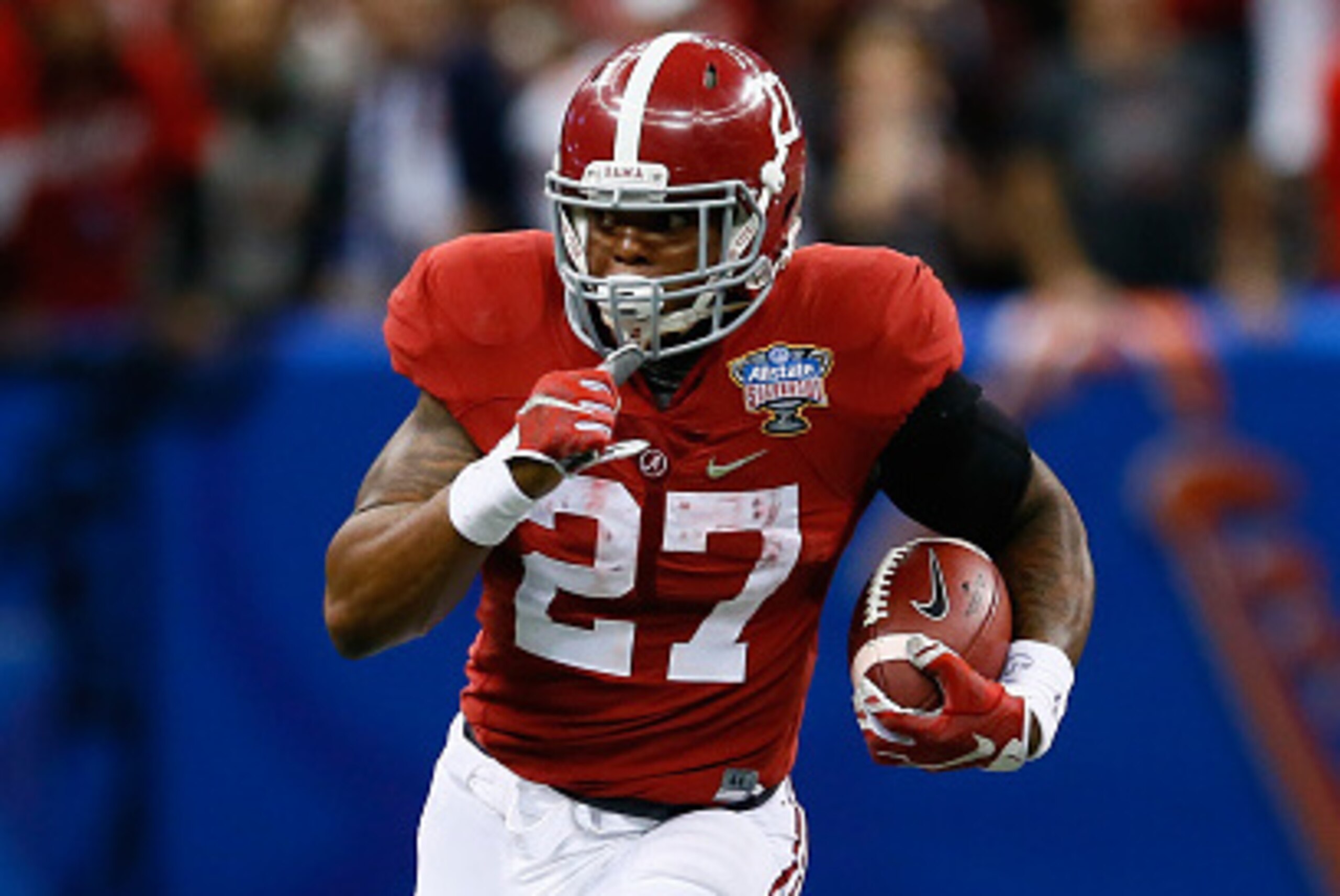 NEW ORLEANS, LA - JANUARY 01:  Derrick Henry #27 of the Alabama Crimson Tide runs the ball against the Ohio State Buckeyes during the All State Sugar Bowl at the Mercedes-Benz Superdome on January 1, 2015 in New Orleans, Louisiana.  (Photo by Kevin C. Cox