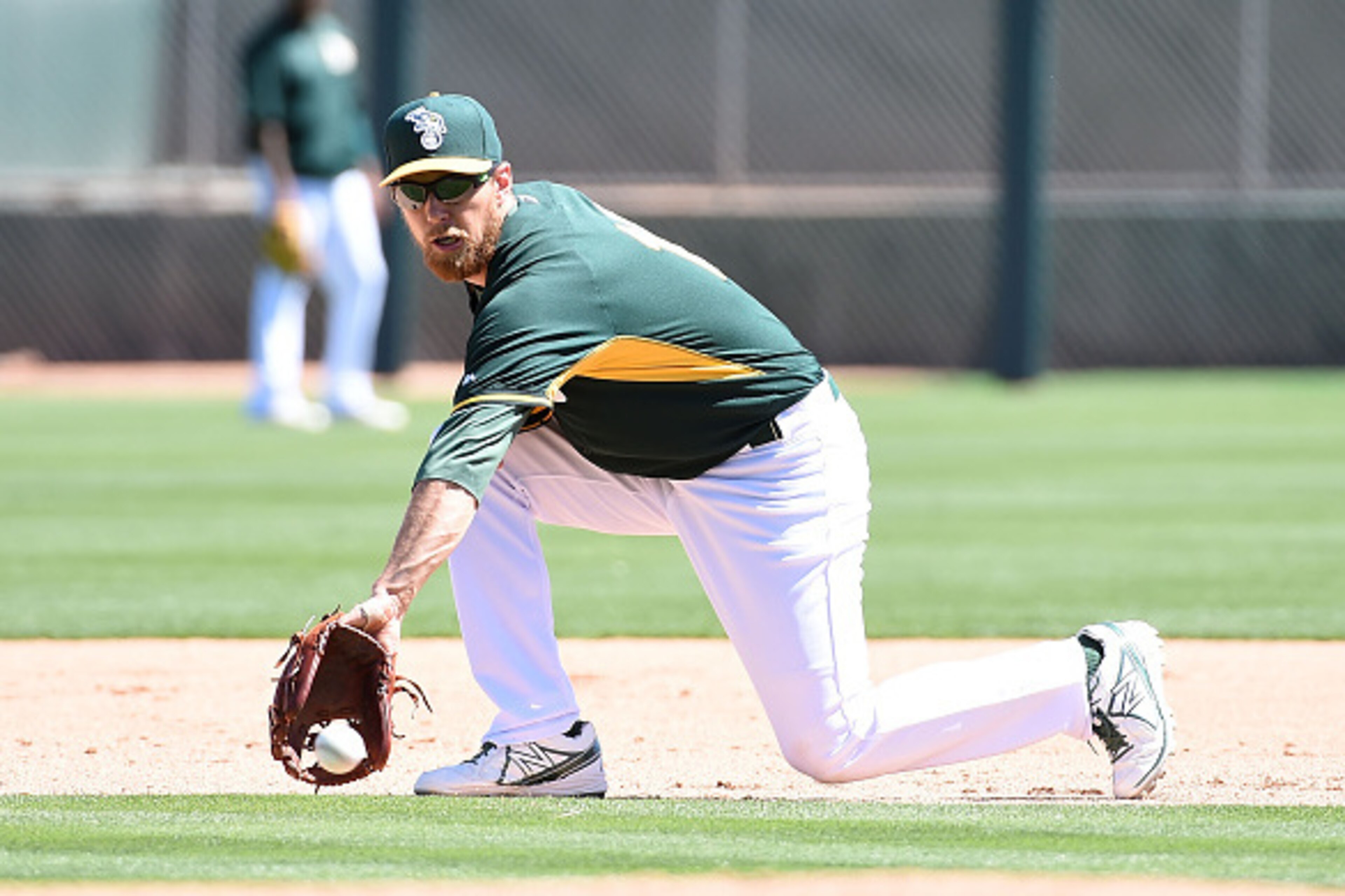 MESA, AZ - MARCH 24:  Ben Zobrist #18 of the Oakland Athletics takes infield practice before action against the Chicago Cubs in a preseason Cactus League game at HoHokam Stadium on March 24, 2015 in Mesa, Arizona.  (Photo by Norm Hall/Getty Images)