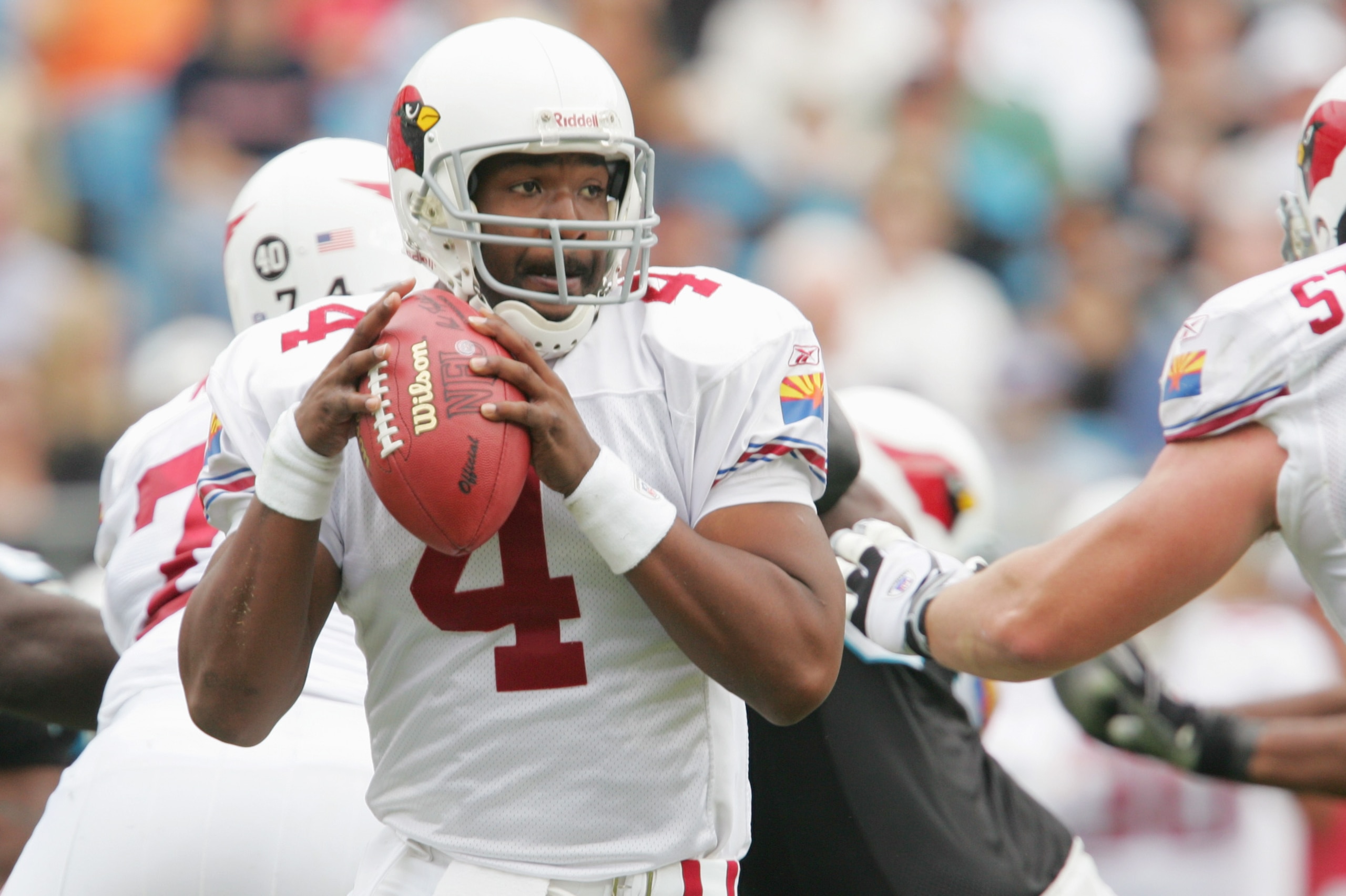 CHARLOTTE, NC - NOVEMBER 21:  Quarterback Shaun King #4 of the Arizona Cardinals drops back to pass during the game against the Carolina Panthers at Bank of America Stadium on November 21, 2004 in Charlotte, North Carolina. The Panthers defeated the Cardi