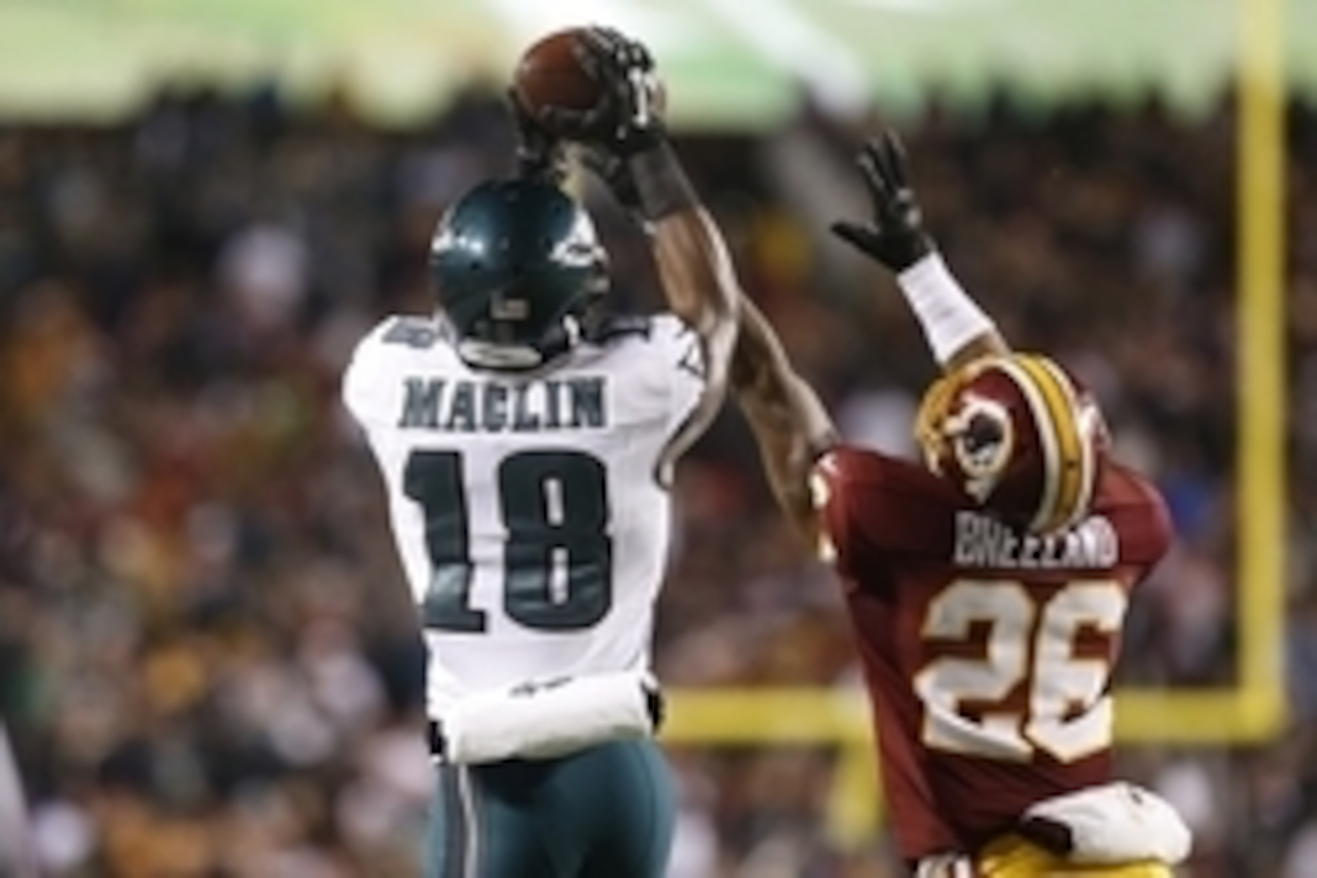 Dec 20, 2014; Landover, MD, USA; Philadelphia Eagles wide receiver Jeremy Maclin (18) catches the ball as Washington Redskins cornerback Bashaud Breeland (26) defends in the fourth quarter at FedEx Field. The Redskins won 27-24. Mandatory Credit: Geoff Bu Dec 20, 2014; Landover, MD, USA; Philadelphia Eagles wide receiver Jeremy Maclin (18) catches the ball as Washington Redskins cornerback Bashaud Breeland (26) defends in the fourth quarter at FedEx Field. The Redskins won 27-24. Mandatory Credit: Geoff Bu