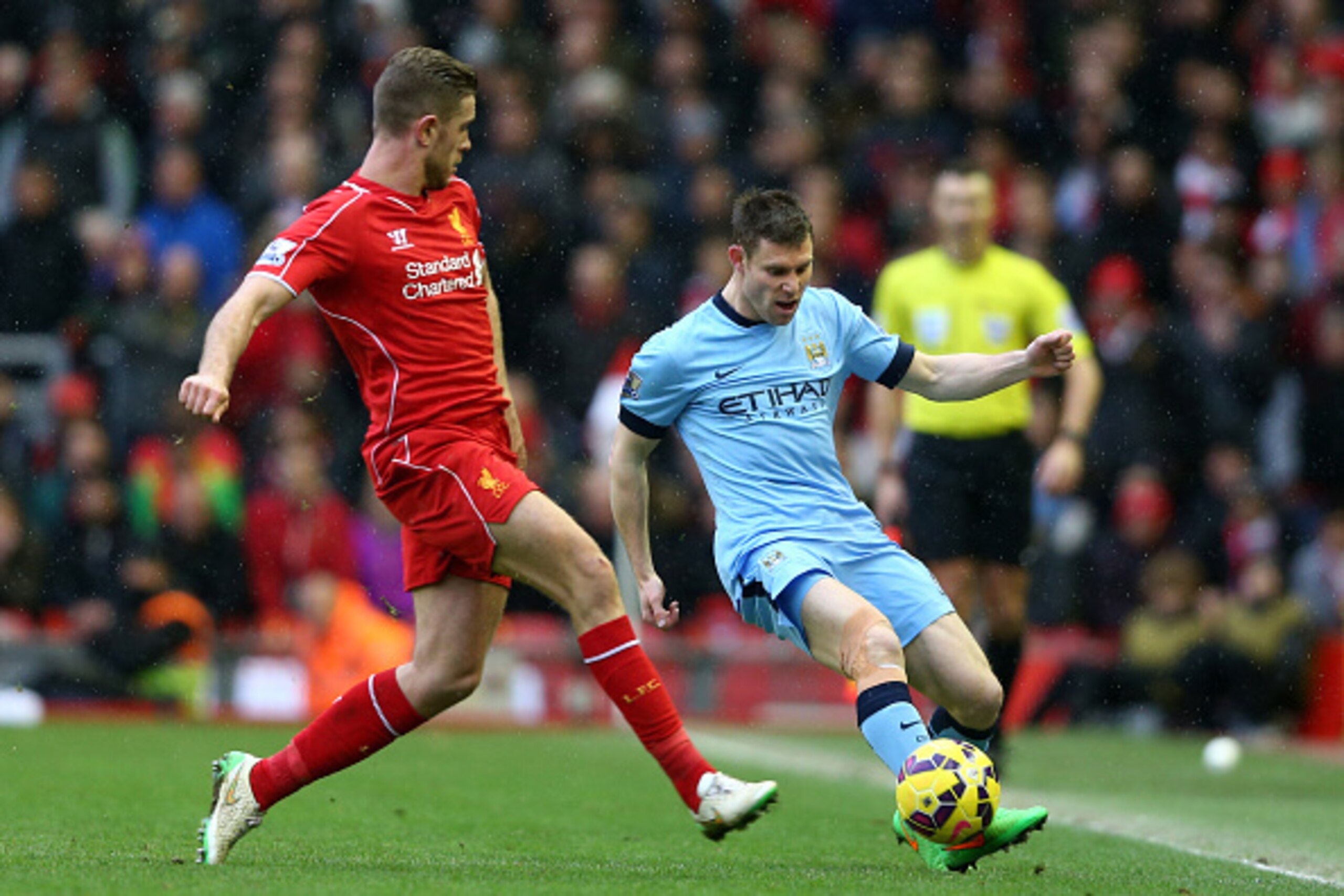 LIVERPOOL, ENGLAND - MARCH 01:  James Milner of Manchester City is closed down by Jordan Henderson of Liverpool during the Barclays Premier League match between Liverpool and Manchester City at Anfield on March 1, 2015 in Liverpool, England.  (Photo by Cl