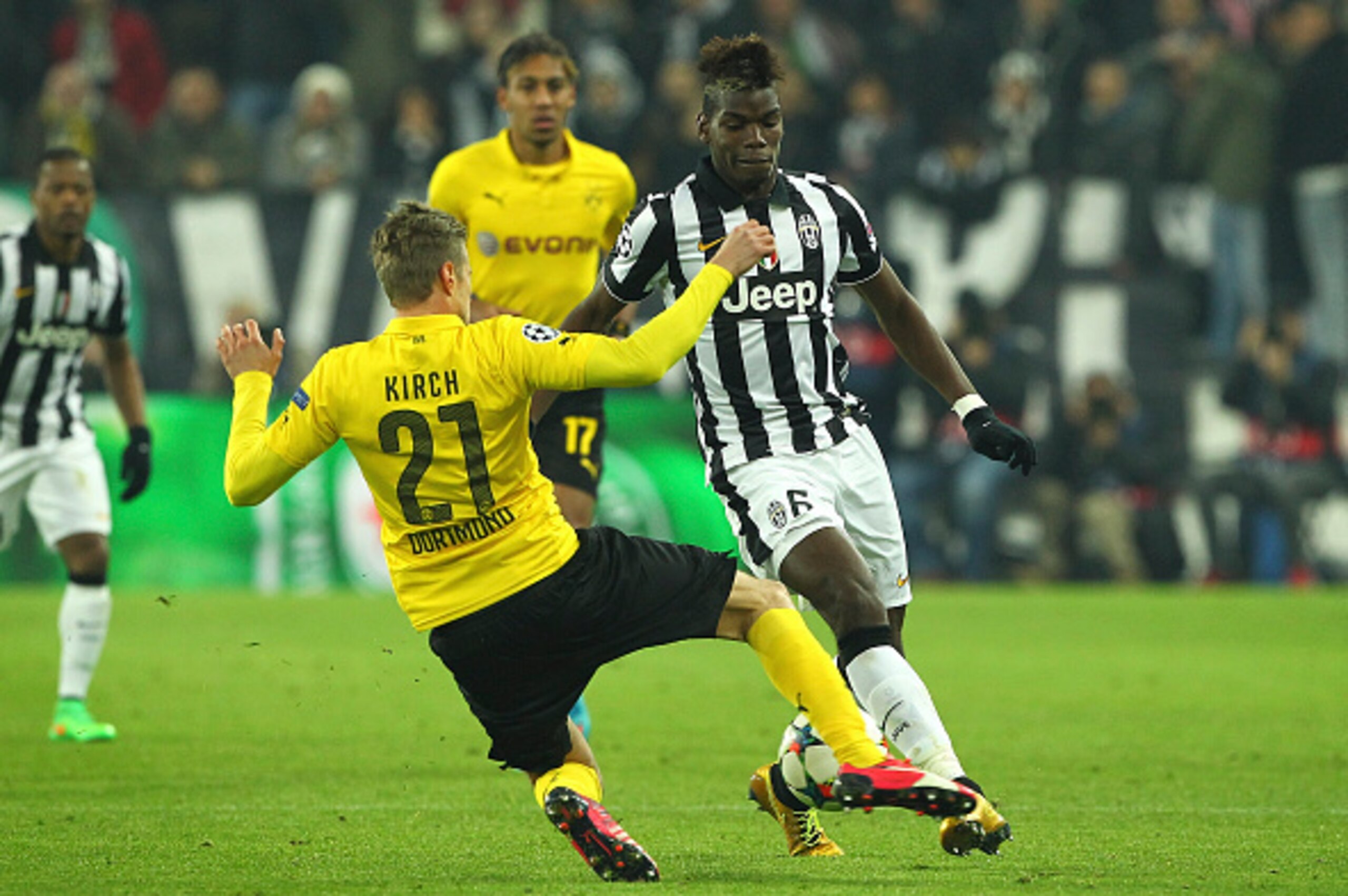 TURIN, ITALY - FEBRUARY 24:  Paul Pogba (R) of Borussia Dortmund competes for the ball with Oliver Kirch (L) of Juventus FC during the UEFA Champions League Round of 16 match between Juventus and Borussia Dortmund at Juventus Arena on February 24, 2015 in