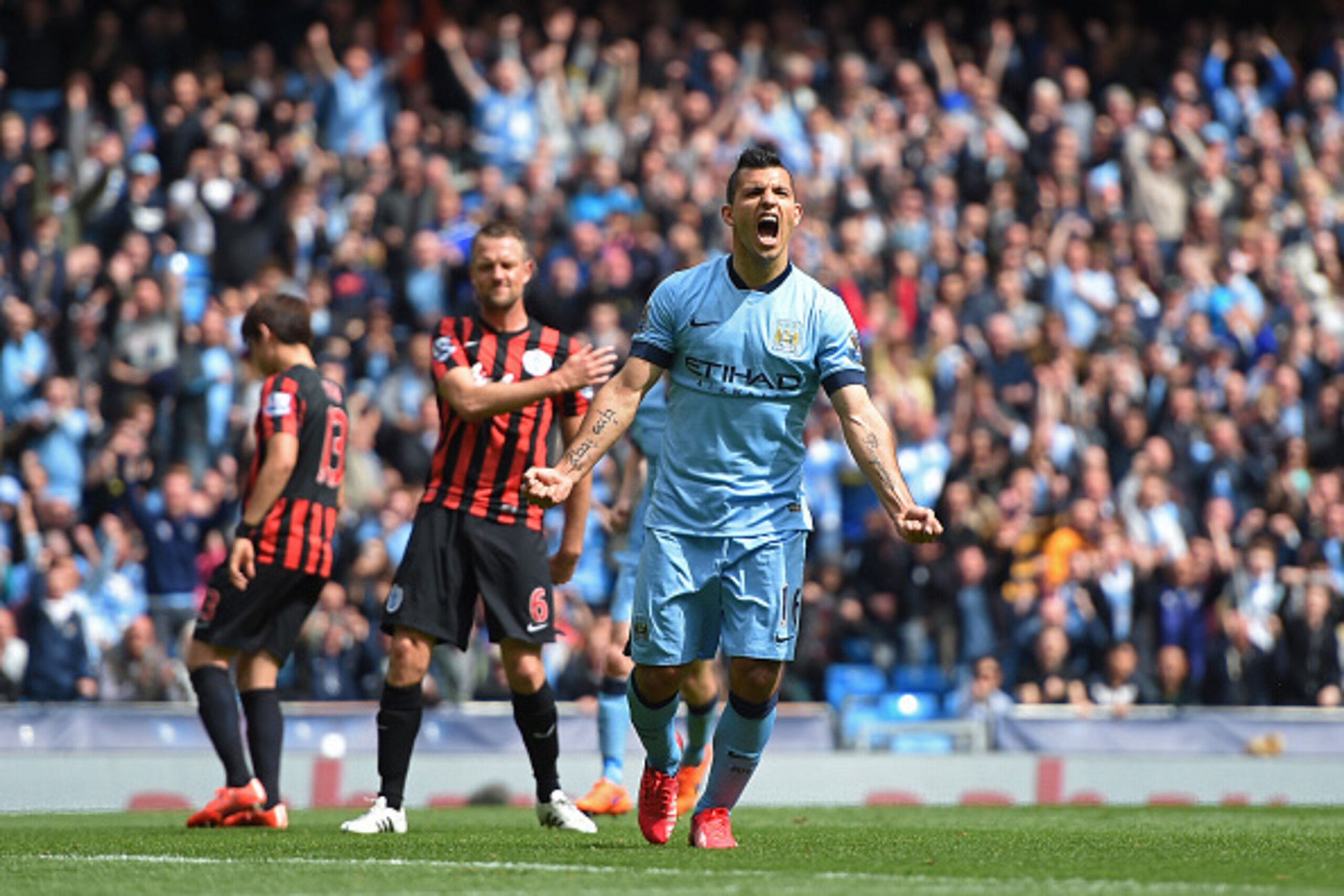 MANCHESTER, ENGLAND - MAY 10:  Sergio Aguero of Manchester City celebrates after scoring his team's fourth goal from the penalty spot during the Barclays Premier League match between Manchester City and Queens Park Rangers at the Etihad Stadium on May 10,