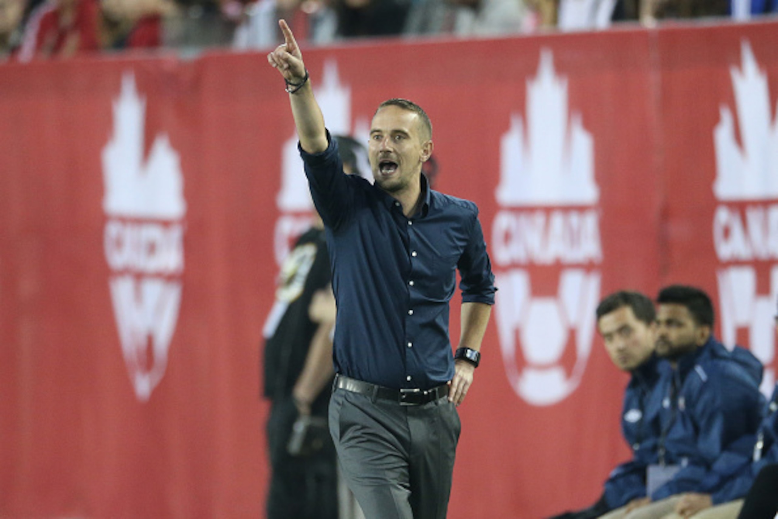 HAMILTON, CANADA - MAY 29: Head coach Mark Sampson of England screams from the sideline against Canada during their Women's International Friendly match on May 29, 2015 at Tim Hortons Field in Hamilton, Ontario, Canada. (Photo by Tom Szczerbowski/Getty Im