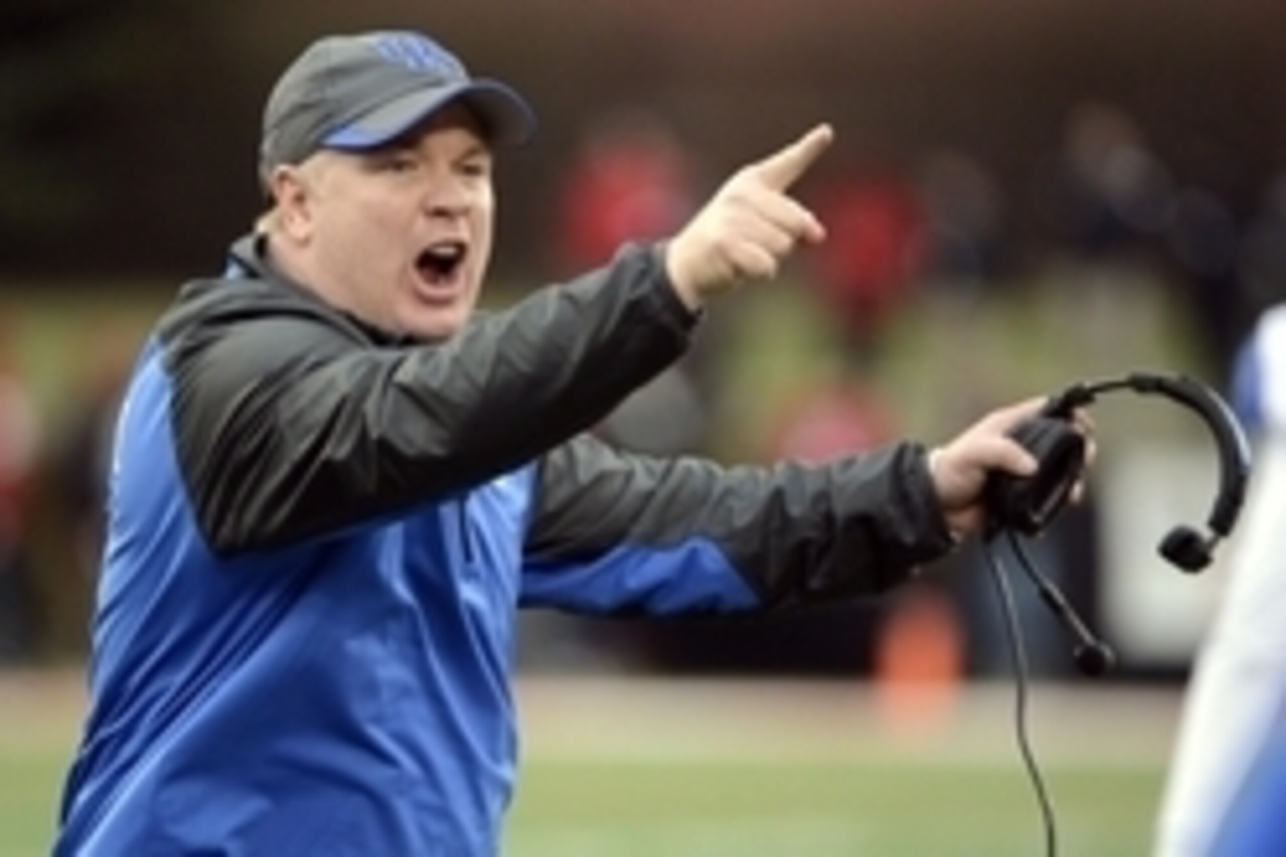 Nov 29, 2014; Louisville, KY, USA; Kentucky Wildcats head coach Mark Stoops reacts during the second half against the Louisville Cardinals at Papa John's Cardinal Stadium. Louisville defeated Kentucky 44-40.  Mandatory Credit: Jamie Rhodes-USA TODAY Sport
