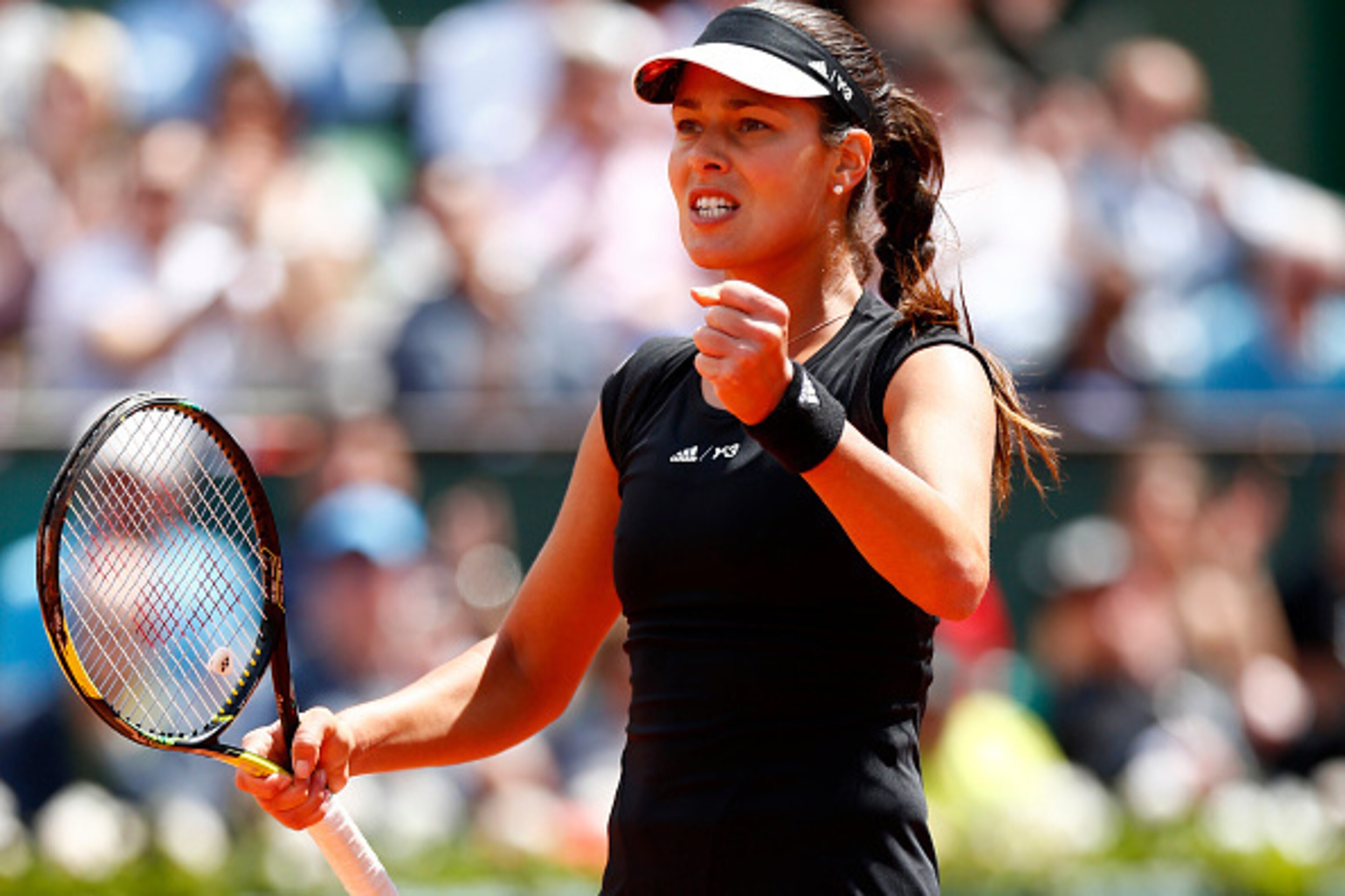 PARIS, FRANCE - JUNE 02:  Ana Ivanovic of Serbia celebrates a point in her Women's quarter final match against Elina Svitolina of Ukraine on day of the 2015 French Open at Roland Garros on June 2, 2015 in Paris, France.  (Photo by Julian Finney/Getty Imag
