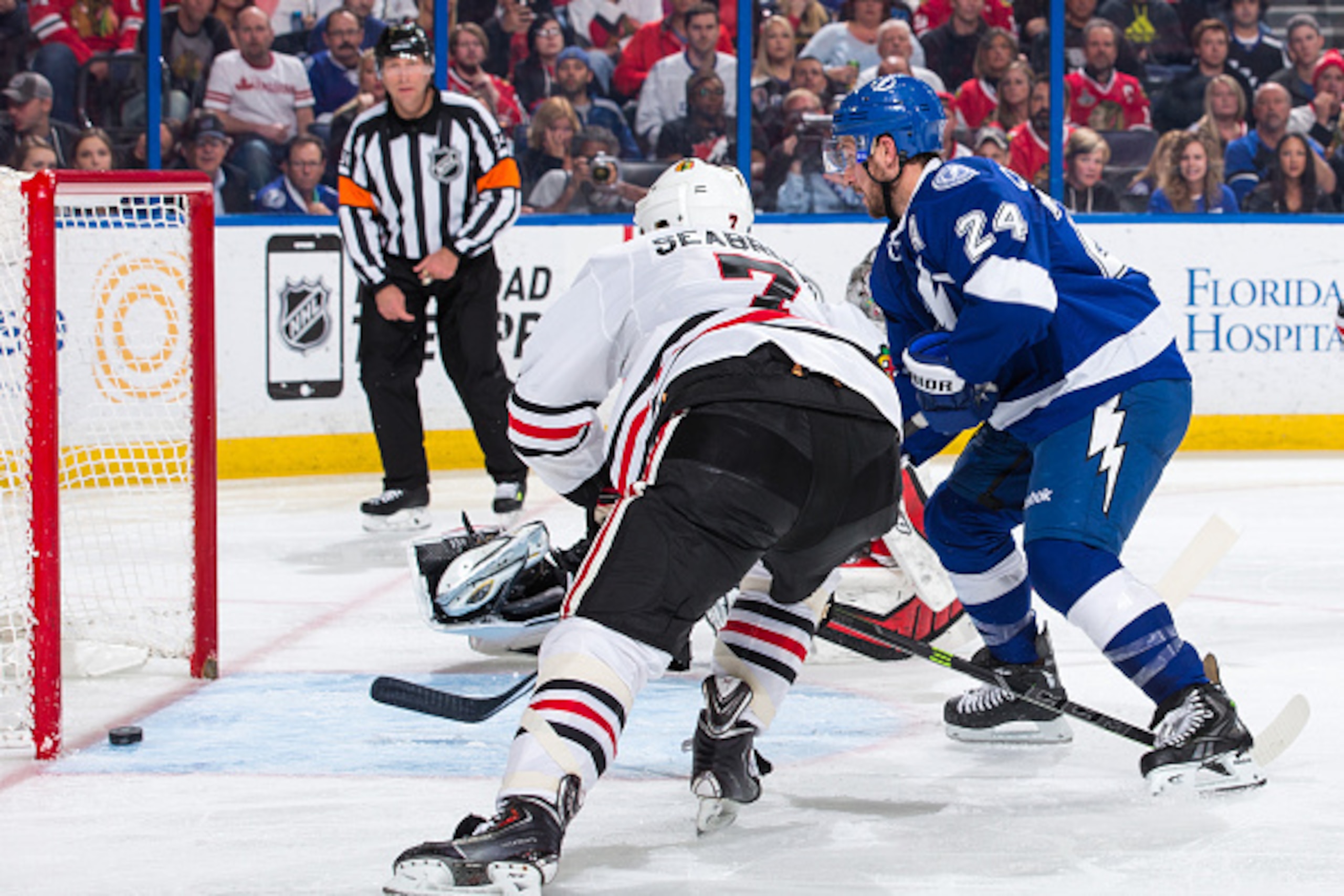 TAMPA, FL - FEBRUARY 27: Ryan Callahan #24 of the Tampa Bay Lightning deflects the puck into the net for a goal after battling against Brent Seabrook #7 of the Chicago Blackhawks during the third period at the Amalie Arena on February 27, 2015 in Tampa, F