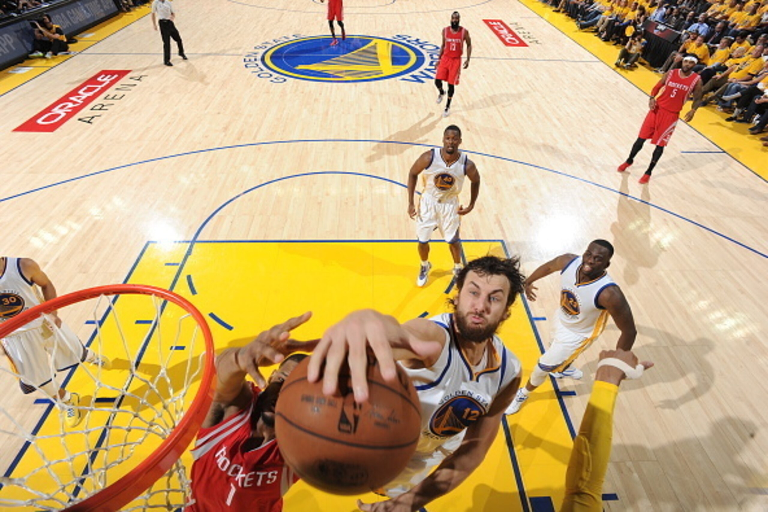 OAKLAND, CA - MAY 27: Andrew Bogut #12 of the Golden State Warriors grabs a rebound against the Houston Rockets in Game Five of the Western Conference Finals during the 2015 NBA Playoffs on May 27, 2015 at ORACLE Arena in Oakland, California. NOTE TO USER