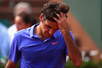 PARIS, FRANCE - JUNE 02:  Roger Federer of Switzerland looks on in his Men's quarter final match against Stanislas Wawrinka of Switzerland on day of the 2015 French Open at Roland Garros on June 2, 2015 in Paris, France.  (Photo by Clive Brunskill/Getty I