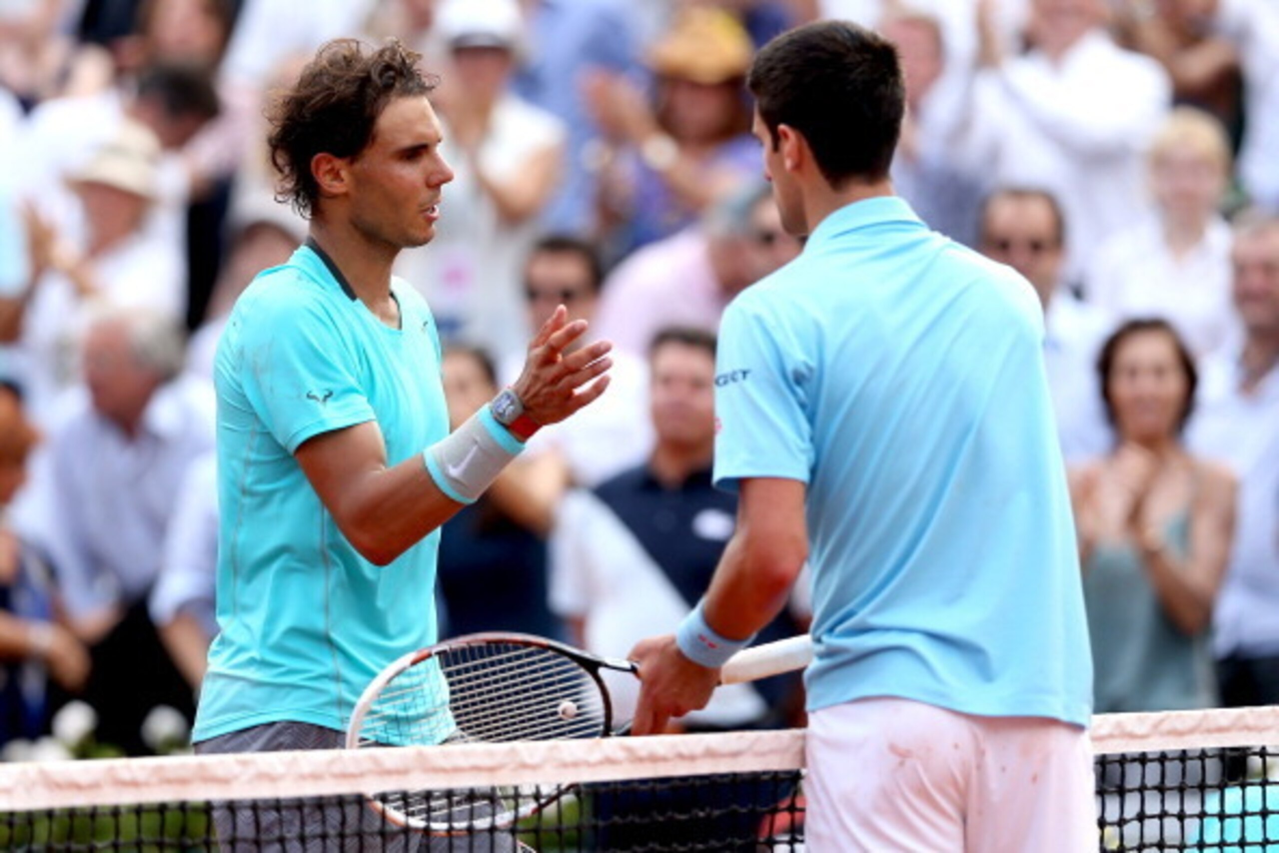 PARIS, FRANCE - JUNE 08:  Rafael Nadal of Spain shakes hands with Novak Djokovic of Serbia after their men's singles final match on day fifteen of the French Open at Roland Garros on June 8, 2014 in Paris, France.  (Photo by Matthew Stockman/Getty Images)