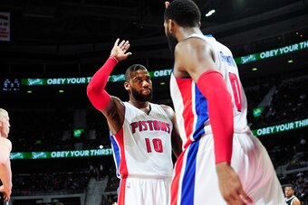 DETROIT, MI - JANUARY 10: Greg Monroe #10 of the Detroit Pistons high fives teammate Andre Drummond #0 of the Detroit Pistons during the game on January 10, 2015 at The Palace of Auburn Hills in Detroit, Michigan. NOTE TO USER: User expressly acknowledges