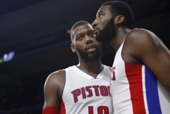 Apr 8, 2015; Auburn Hills, MI, USA; Detroit Pistons forward Greg Monroe (10) talks to Pistons center Andre Drummond (0) during the third quarter against the Boston Celtics at The Palace of Auburn Hills. Celtics beat the Pistons 113-103. Mandatory Credit: 