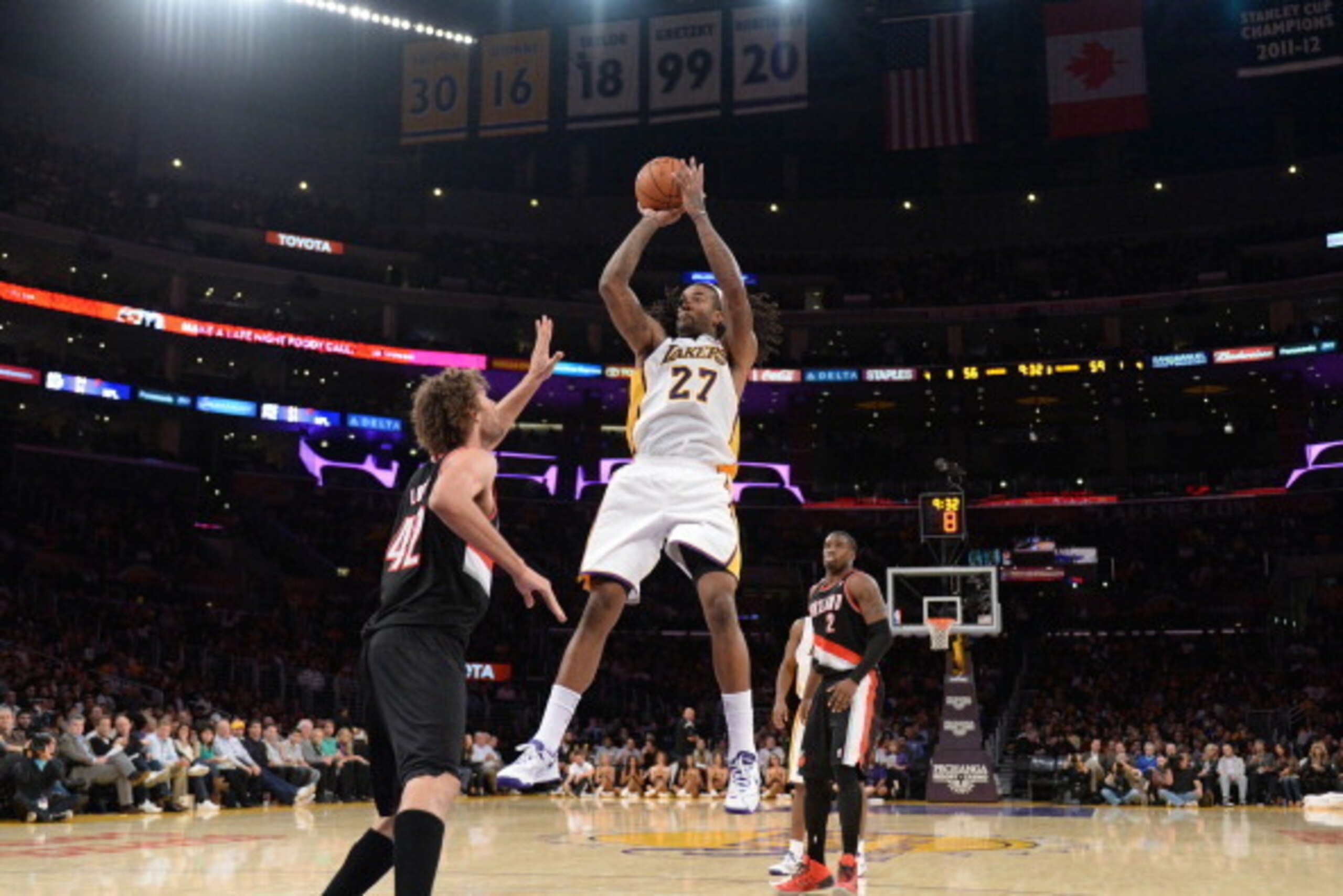 LOS ANGELES, CA - DECEMBER 1: Jordan Hill #27 of the Los Angeles Lakers shoots against Robin Lopez #42 of the Portland Trail Blazers at Staples Center on December 1, 2013 in Los Angeles, California. NOTE TO USER: User expressly acknowledges and agrees tha