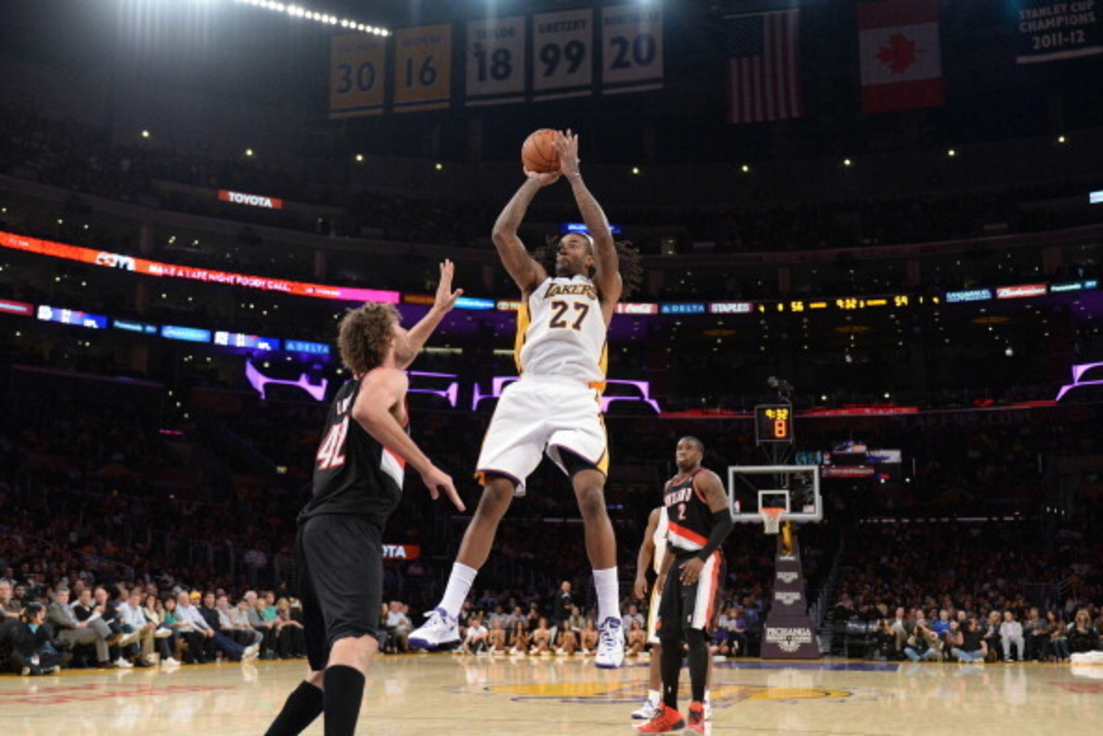 LOS ANGELES, CA - DECEMBER 1: Jordan Hill #27 of the Los Angeles Lakers shoots against Robin Lopez #42 of the Portland Trail Blazers at Staples Center on December 1, 2013 in Los Angeles, California. NOTE TO USER: User expressly acknowledges and agrees tha
